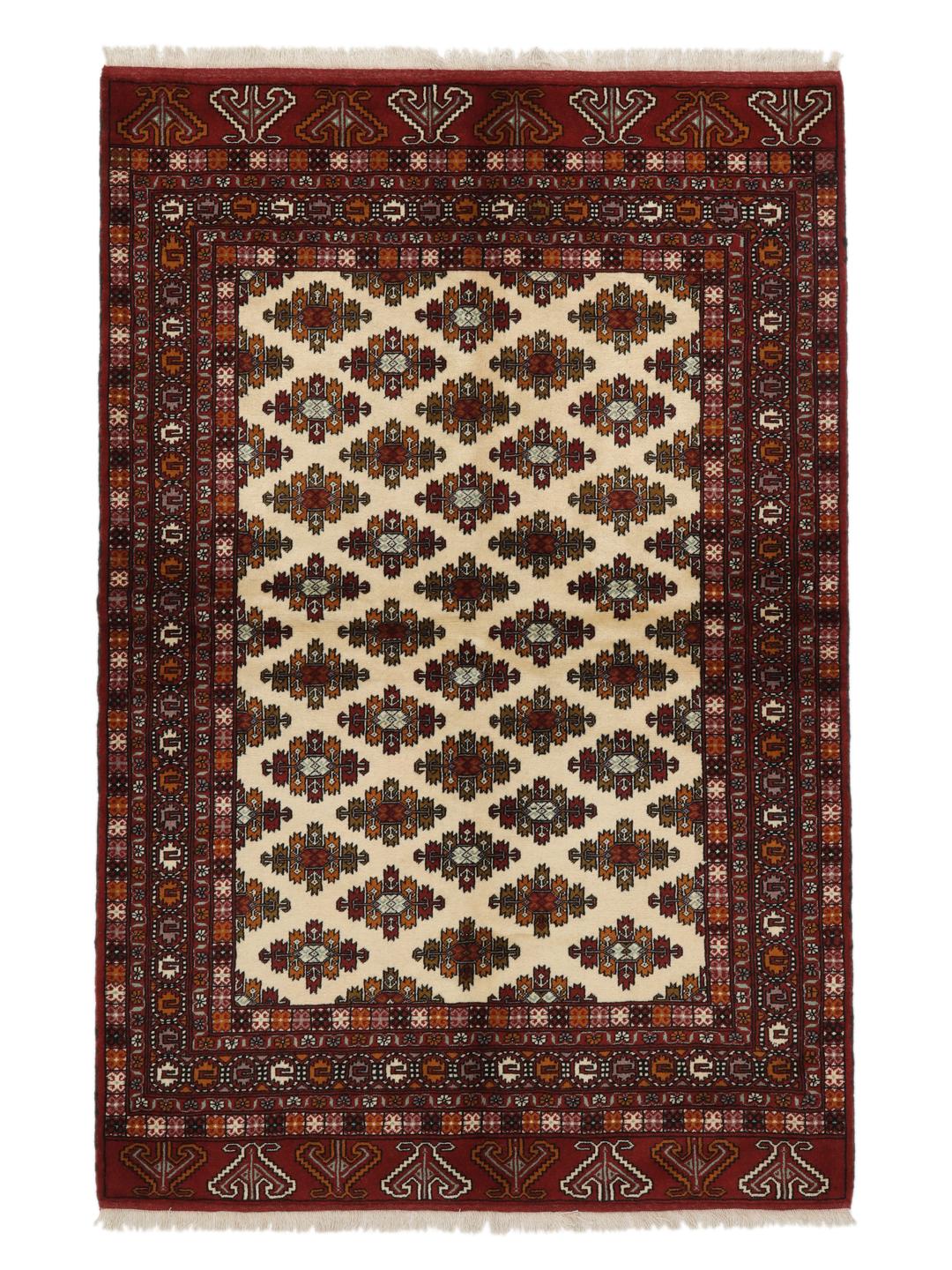 Hand-knotted Turkaman Wool rug from the Middle East in deep red and beige tones
