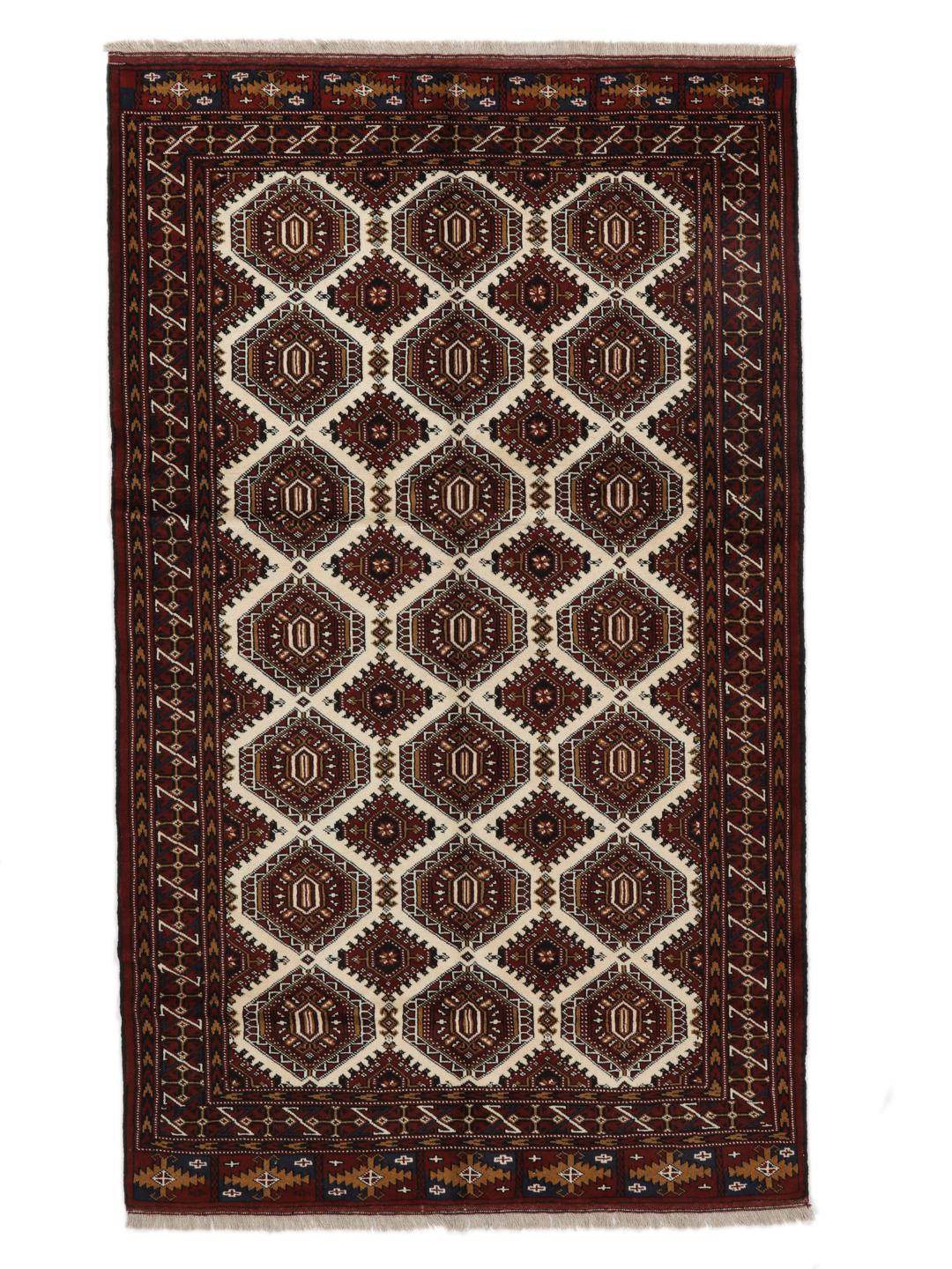 Hand-knotted Turkaman rug from the Middle East in deep red and beige tones