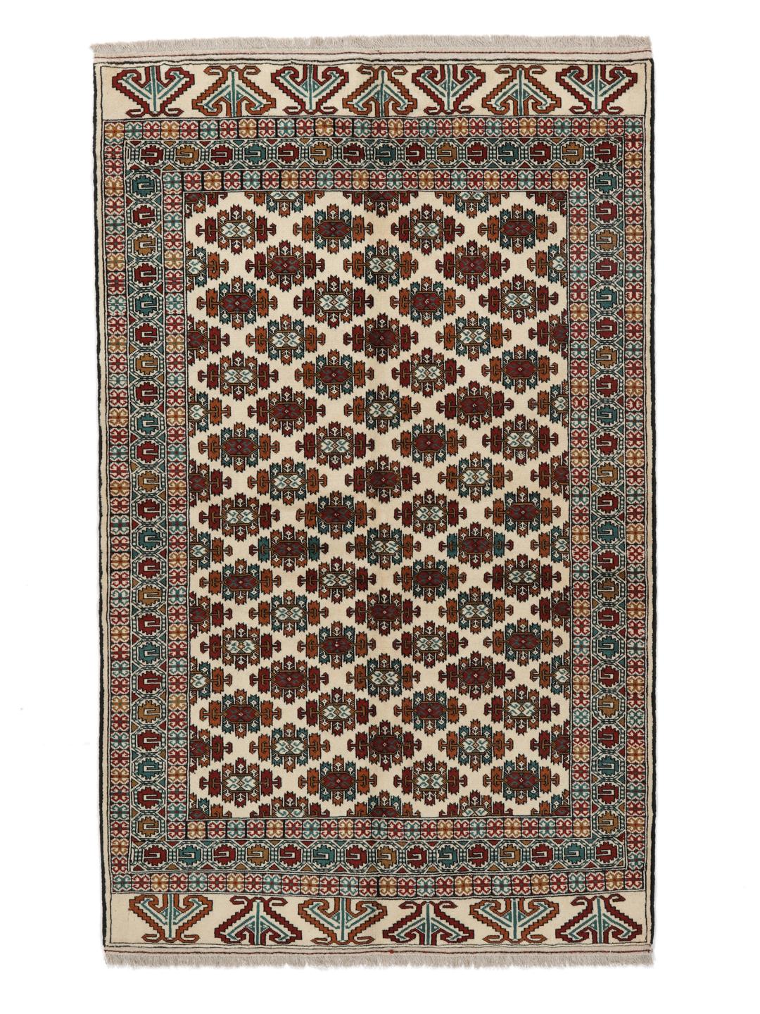 Hand-knotted Turkaman rug from the Middle East in beige with repeating geometric motifs