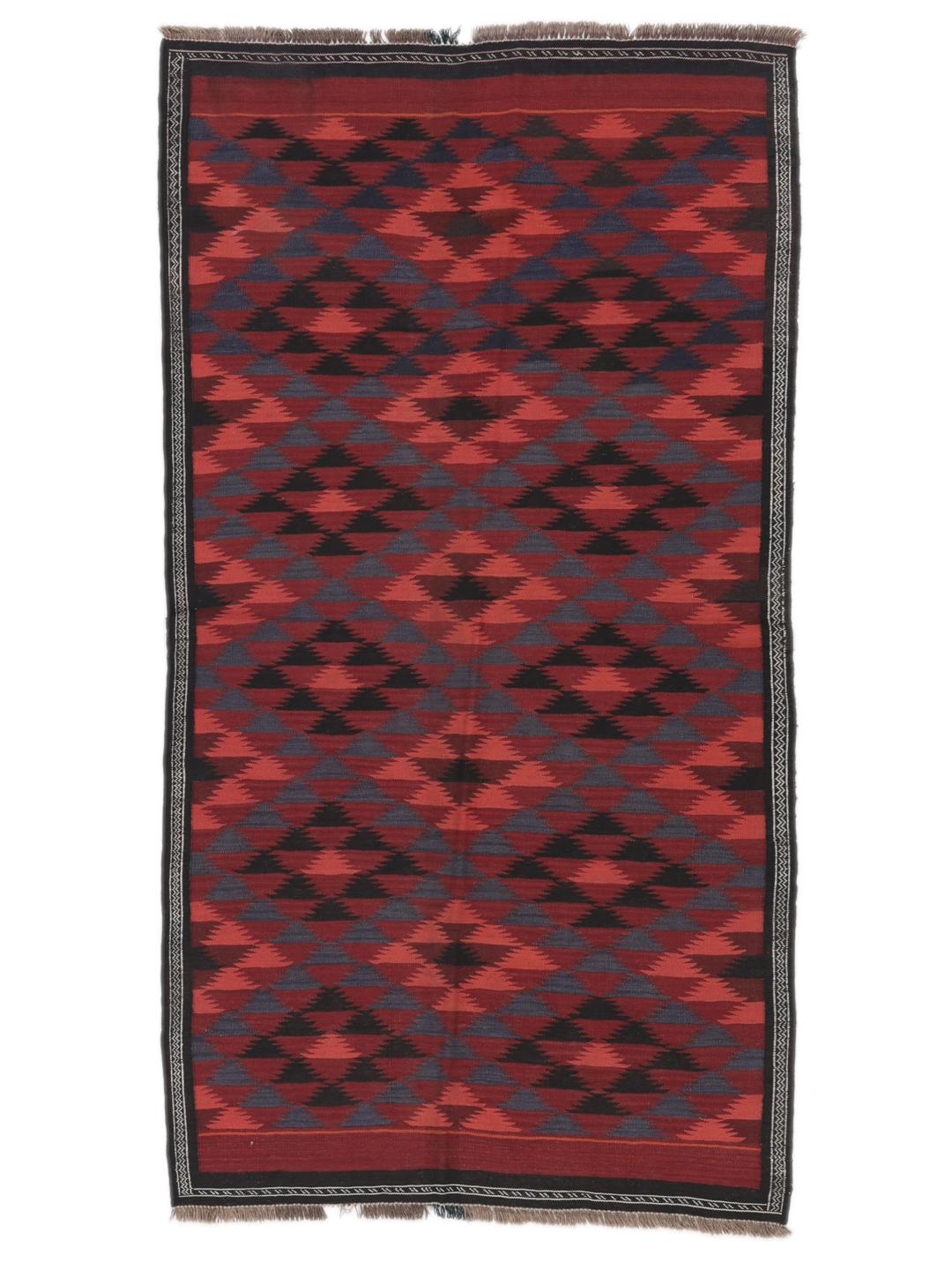 Tapis kelim afghan tissé à la main avec des motifs géométriques dans des tons rouges et sombres.