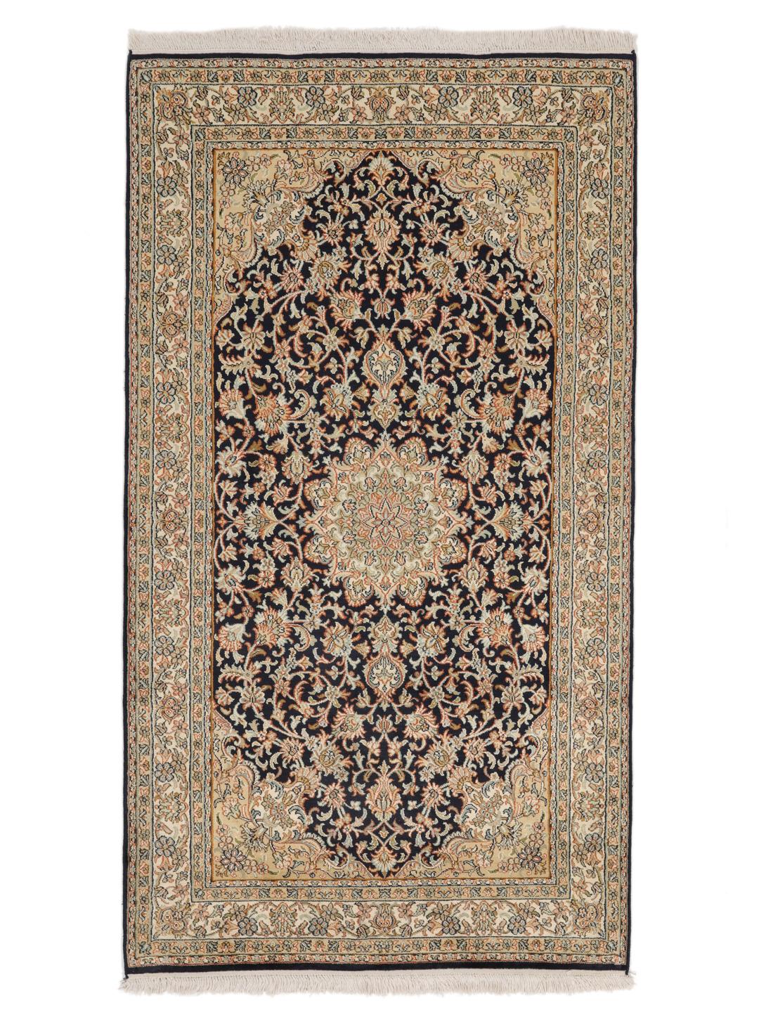Hand-knotted Indian silk rug with intricate floral medallion patterns in blue and beige.