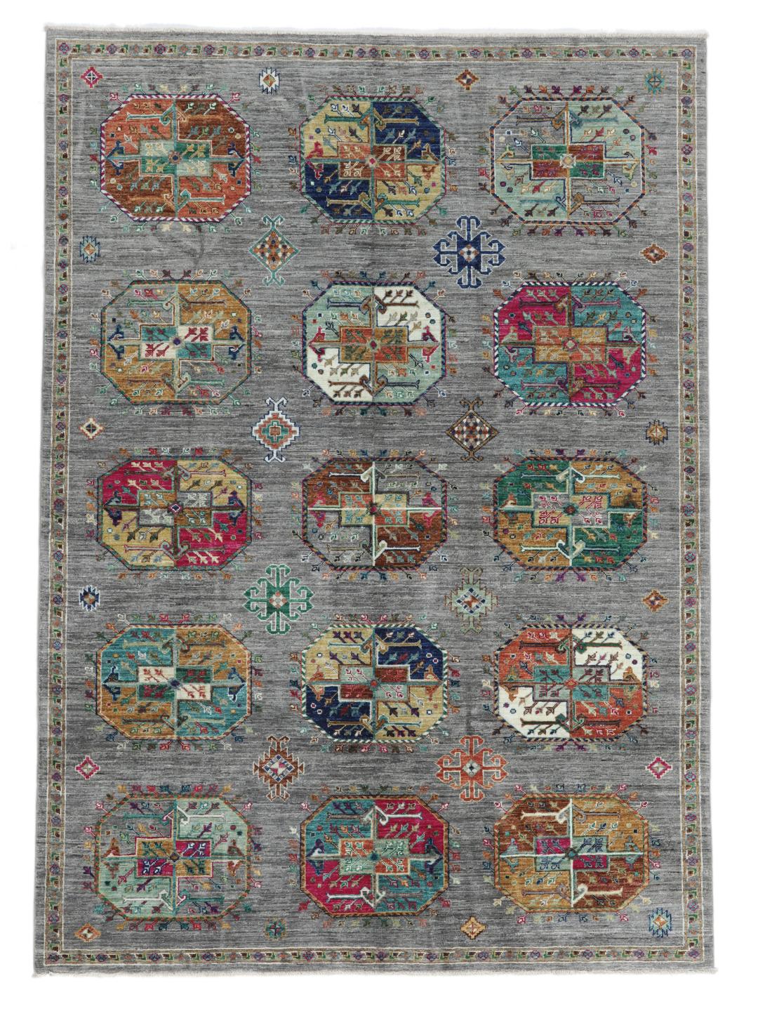 Hand-knotted rug from the Middle East with vibrant geometric medallions on a grey background