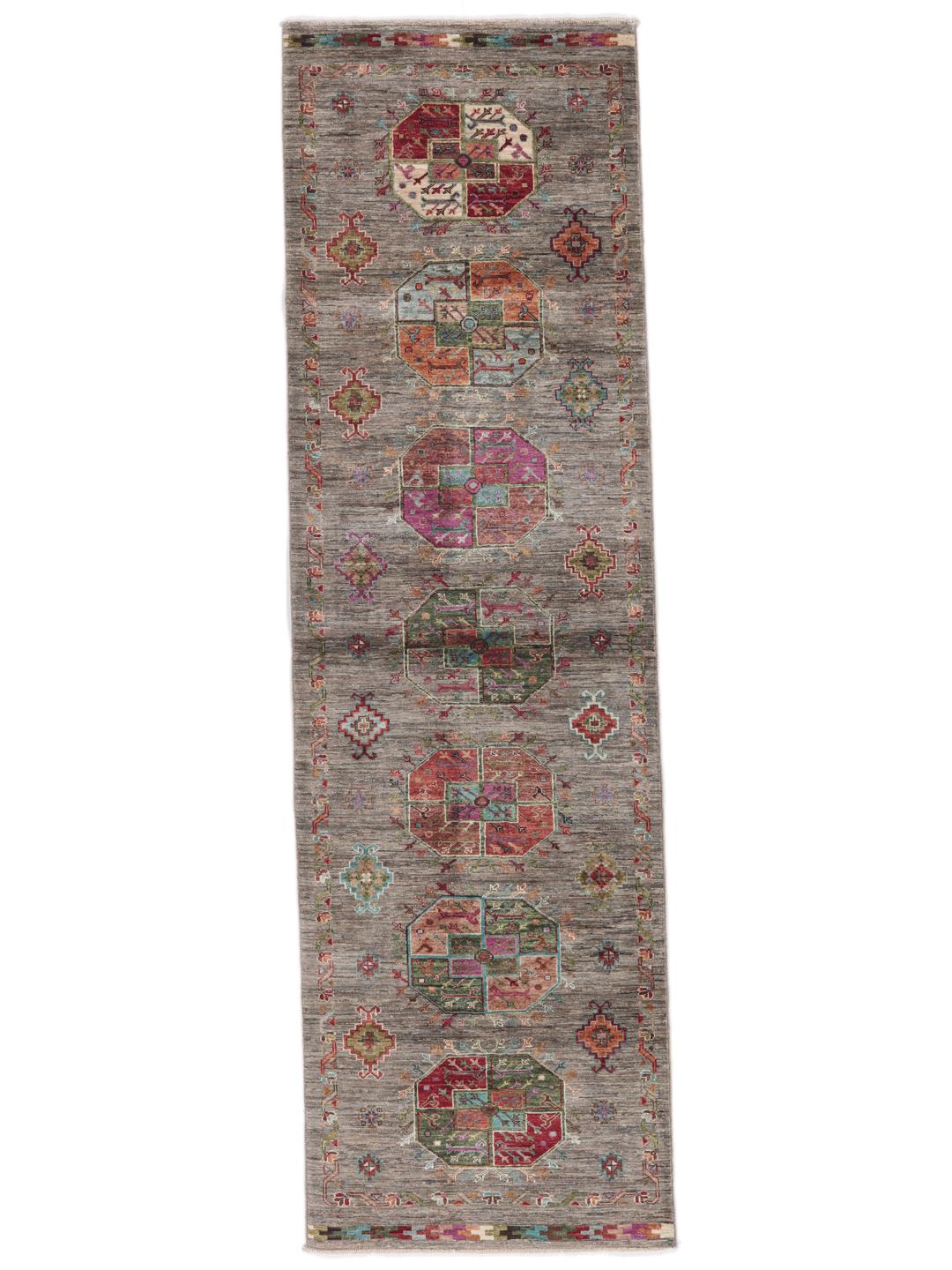 A unique Afghan wool runner featuring colourful geometric motifs on a grey background