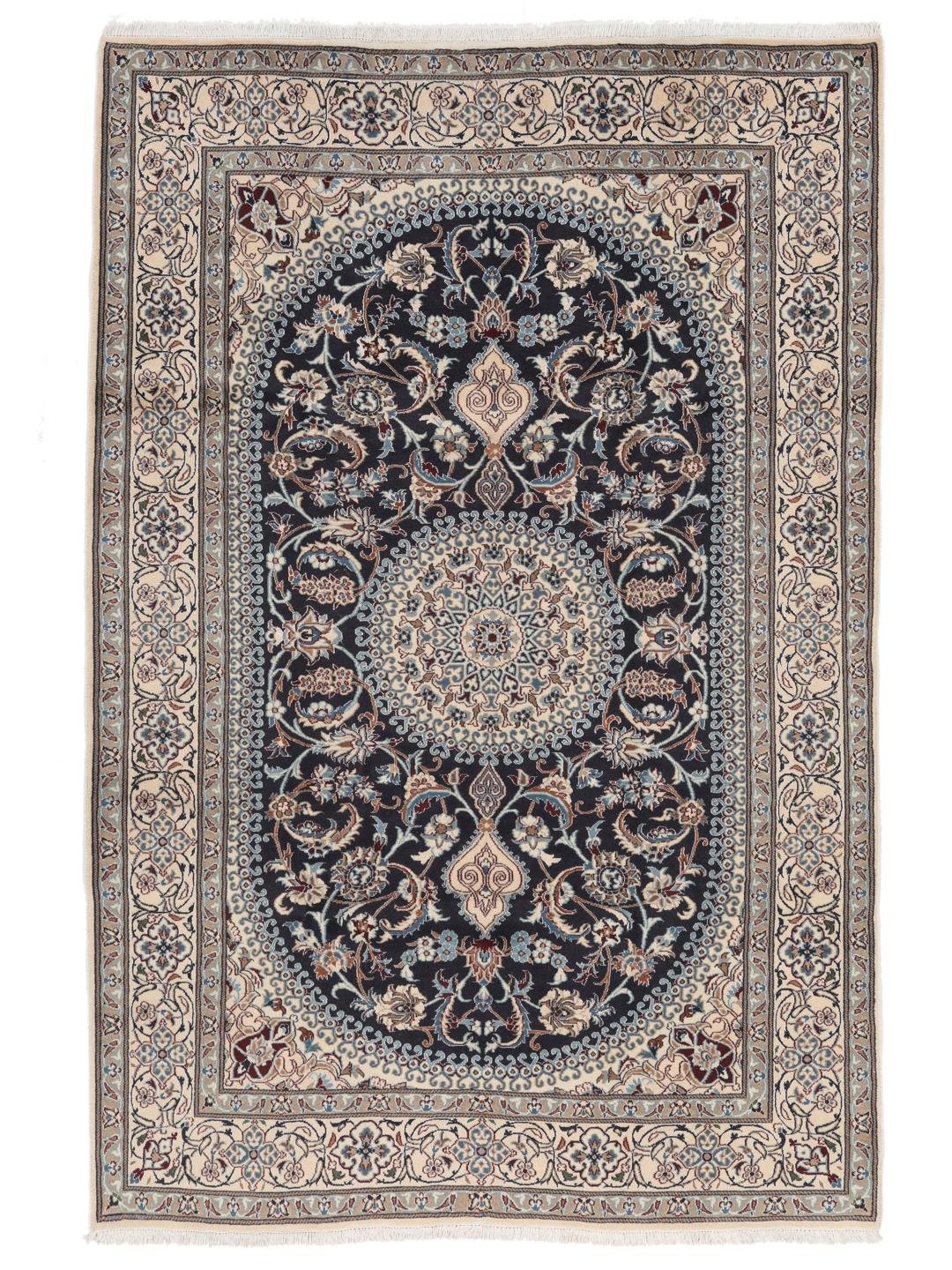 Hand-knotted Nain rug from the Middle East with a dark-blue and cream floral design.