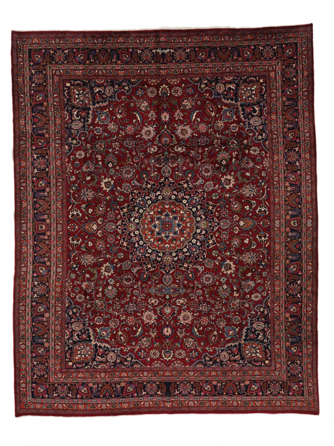 Hand-knotted Mashad rug from the Middle East in deep dark-red with floral pattern