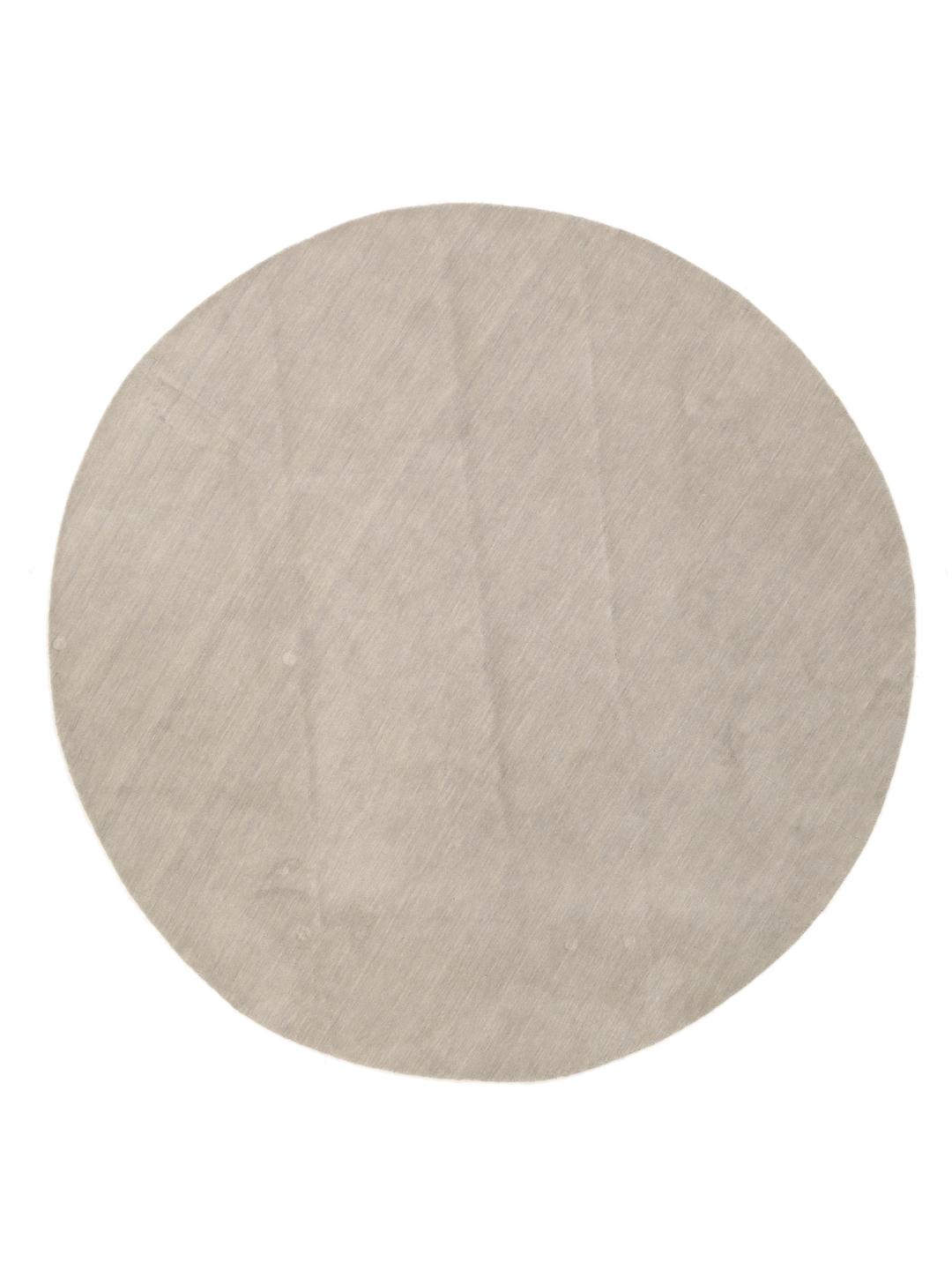 Rond beige tapijt met een minimalistische textuur
