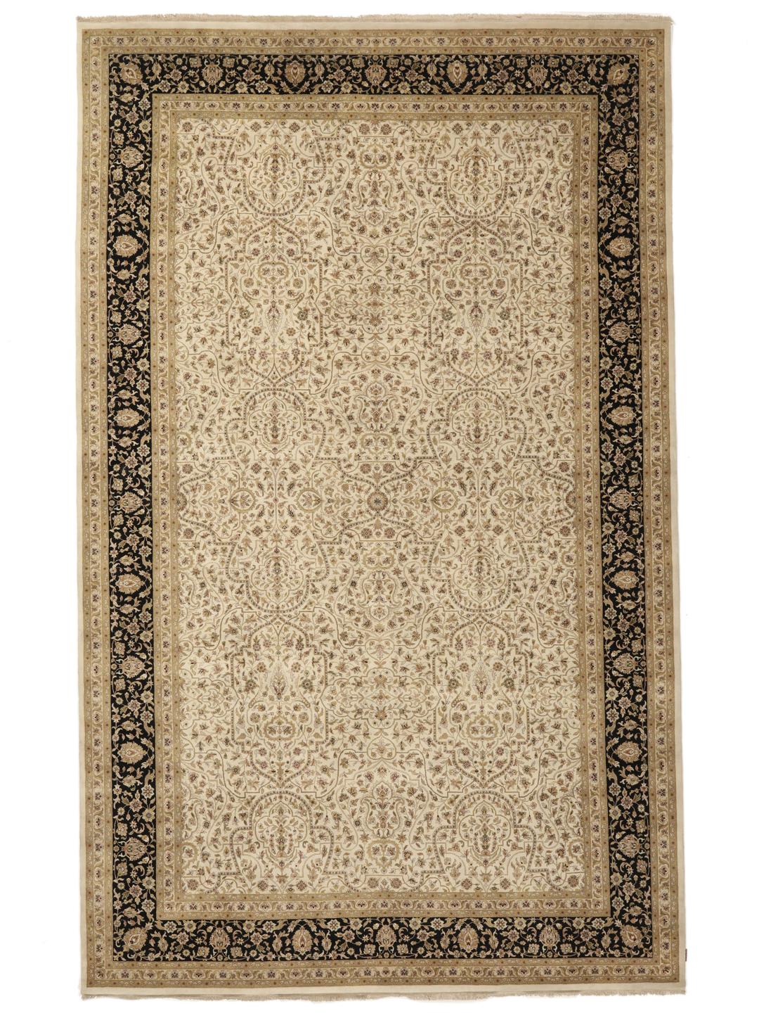 A large, hand-knotted Sarough rug from India featuring an intricate floral design on a beige field with a black border.