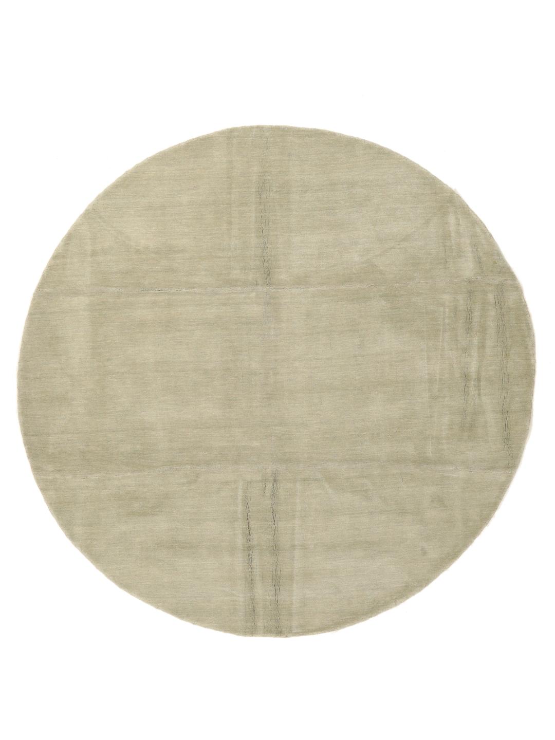 Rond beige tapijt met een zacht, minimalistisch oppervlak