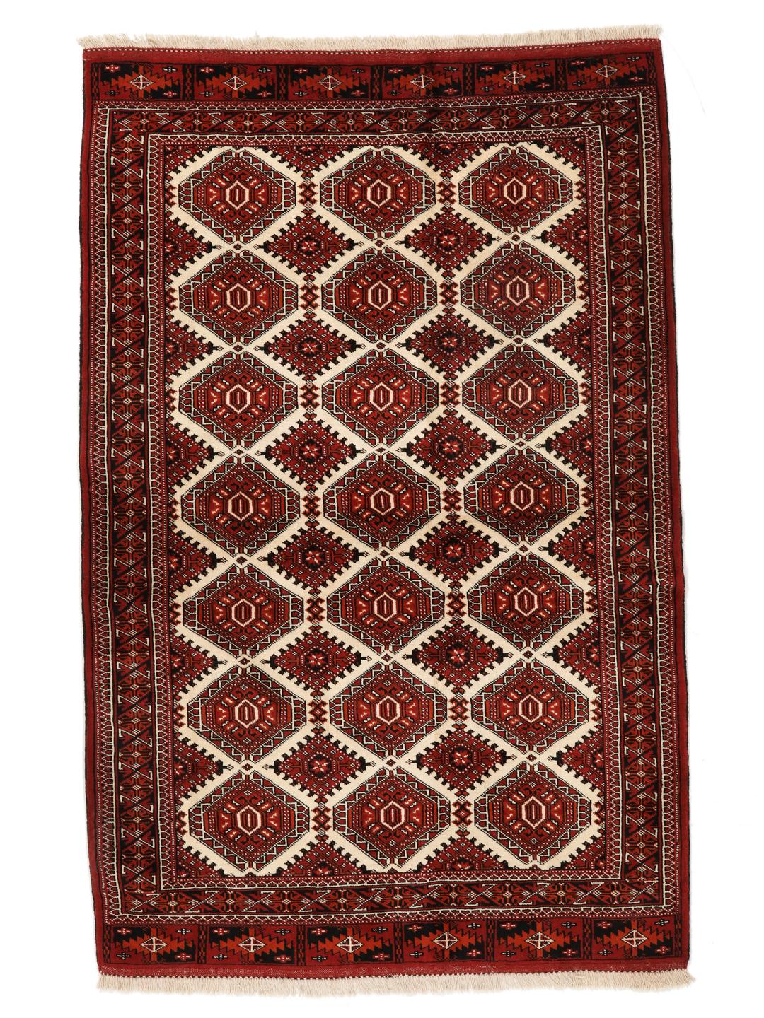 Hand-knotted Turkaman rug from the Middle East in red and black