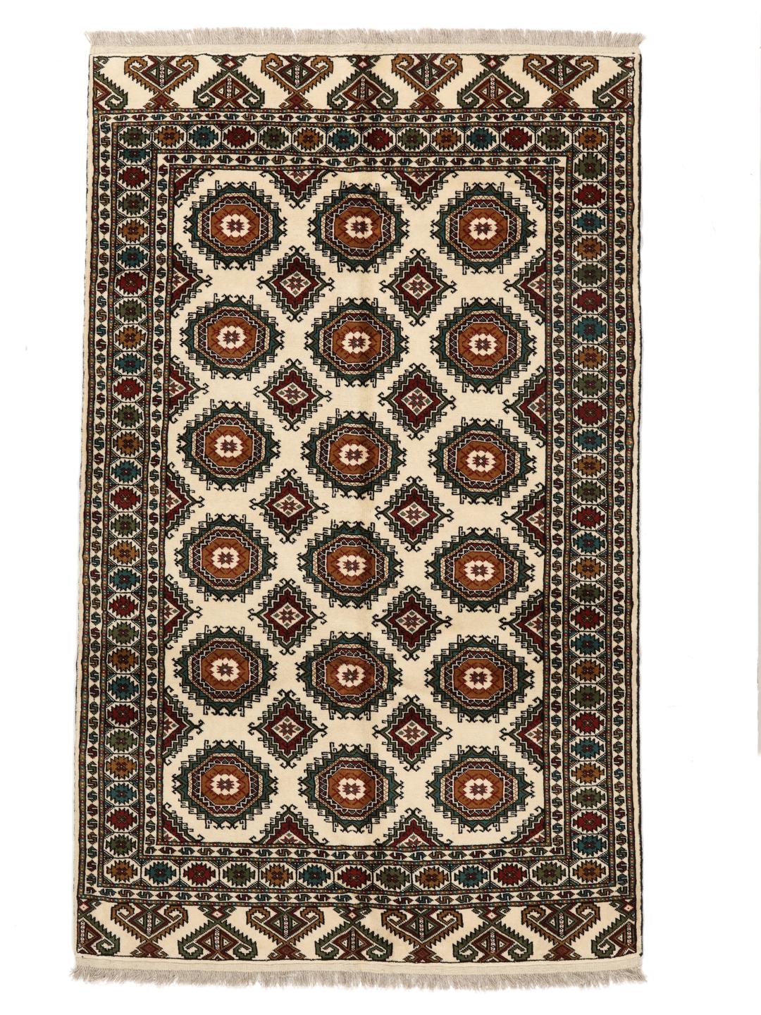 Hand-knotted Turkaman rug from the Middle East in red and beige tones.