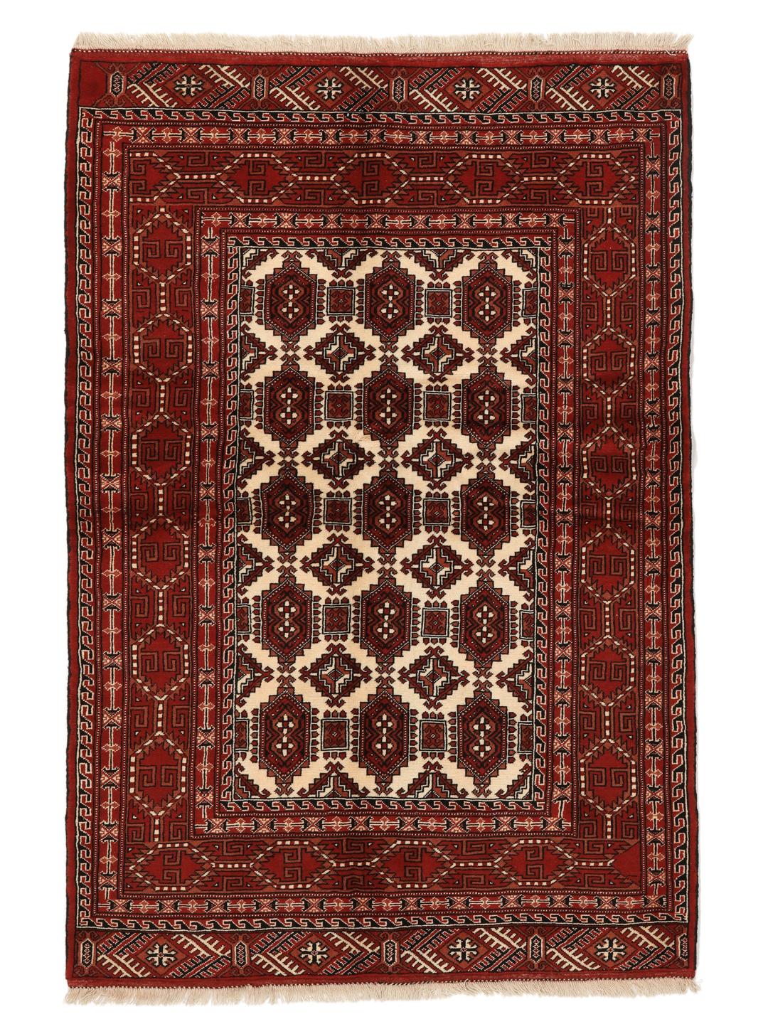 A hand-knotted, one-of-a-kind Turkaman rug with a red field and traditional geometric motifs.