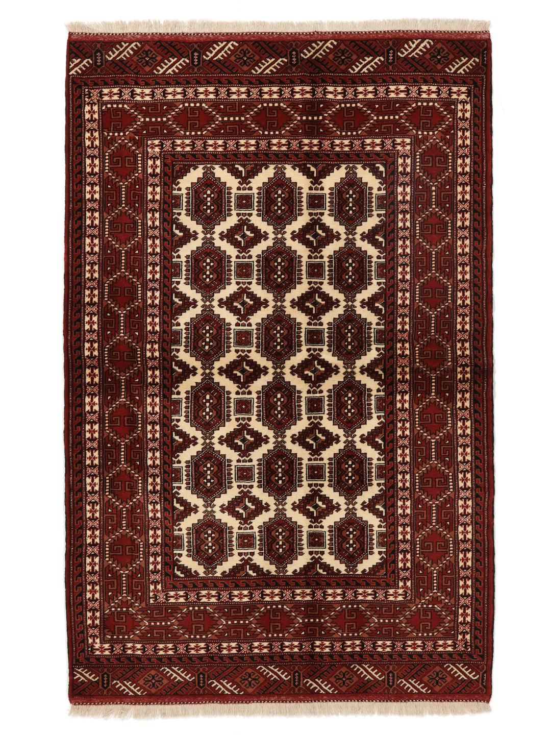 Hand-knotted Turkaman rug from the Middle East in deep red and cream tones.