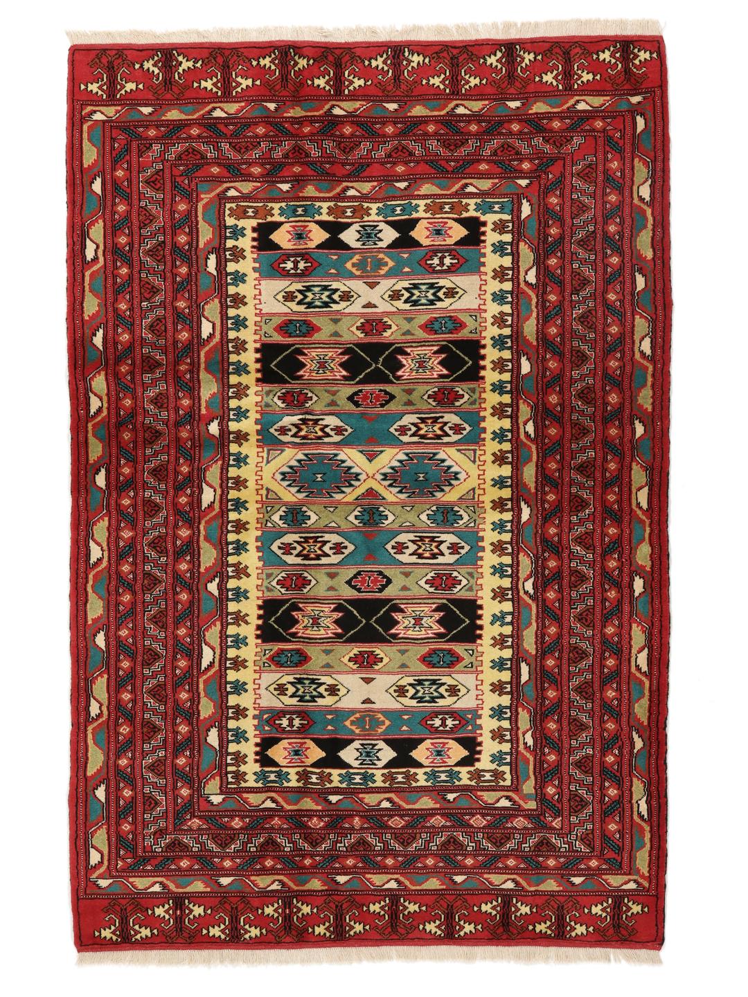 A hand-knotted Turkaman rug from the Middle East with a vibrant red and multicoloured geometric design.