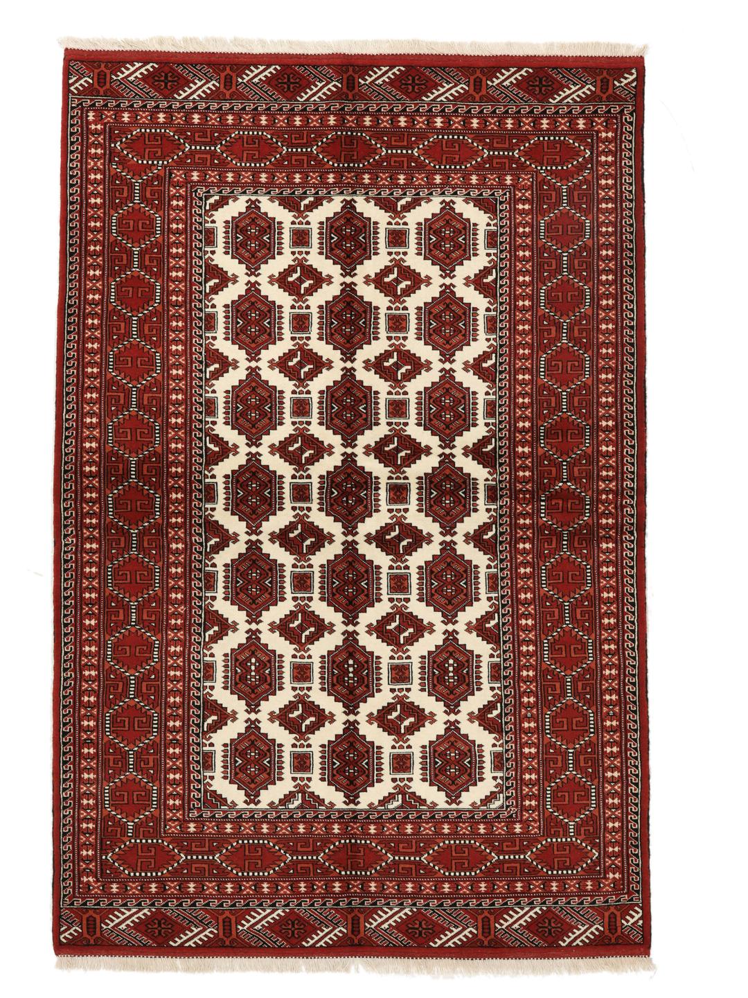 Hand-knotted Turkaman rug from the Middle East with a red and cream geometric design