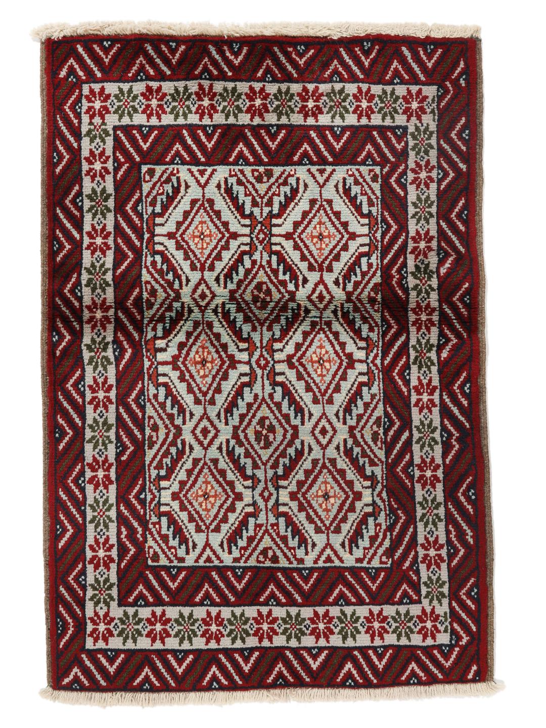 Hand-knotted Baluch rug with geometric motifs and red tones from the Middle East