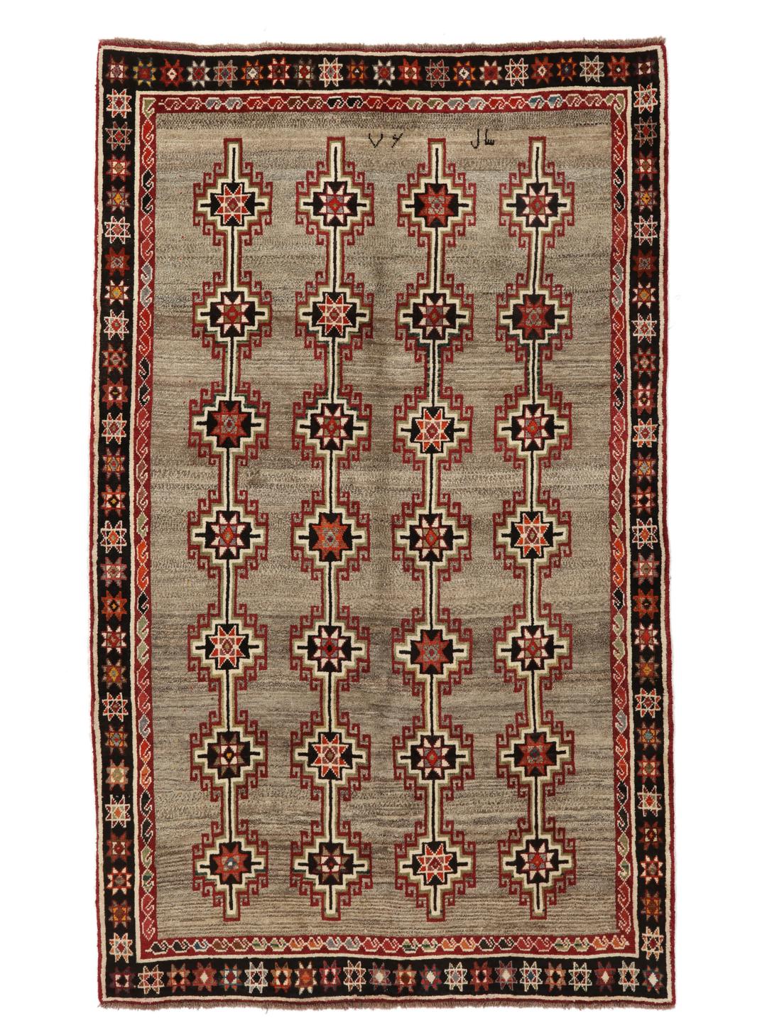 Håndknyttet Qashqai-tæppe fra Mellemøsten i brun med geometriske tribal-mønstre.