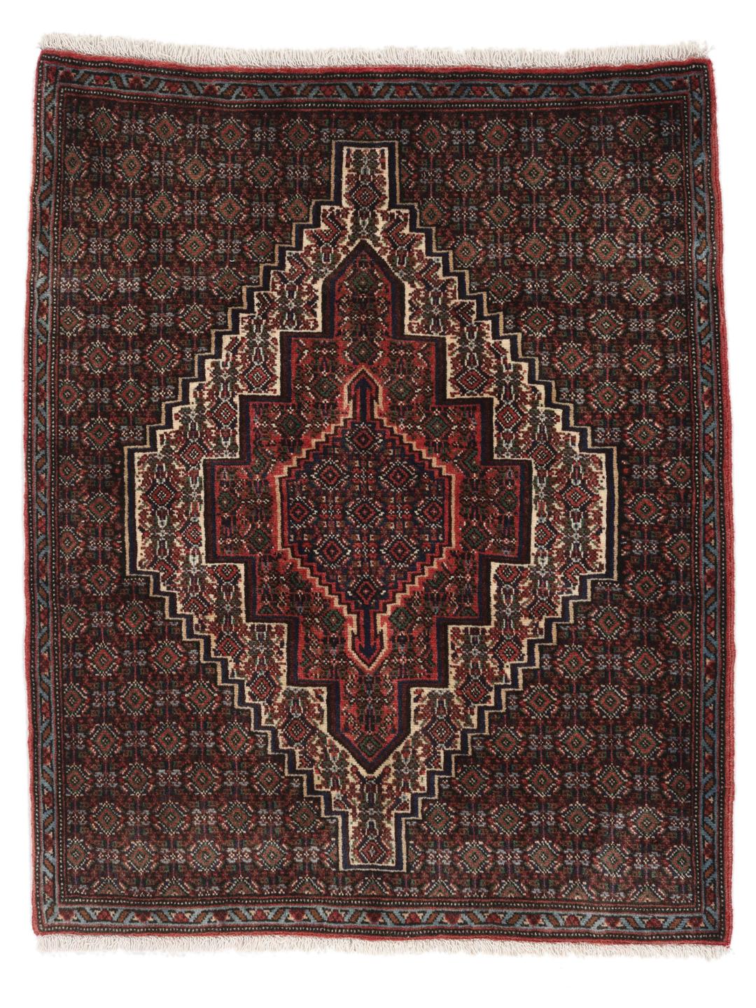 A hand-knotted Senneh rug from the Middle East in dark-red and dark-blue tones.