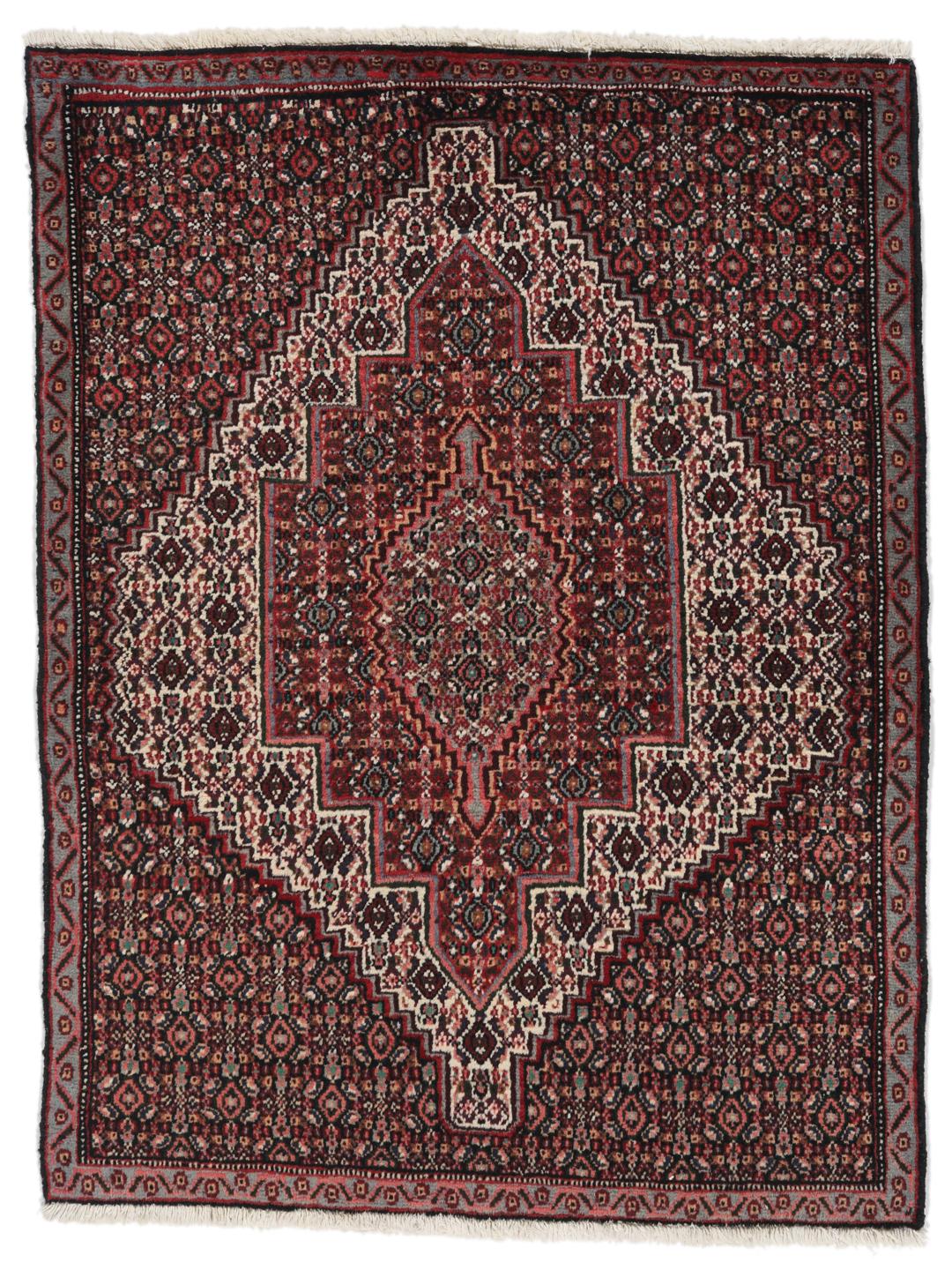 Hand-knotted Senneh rug from the Middle East in dark-red and black tones.