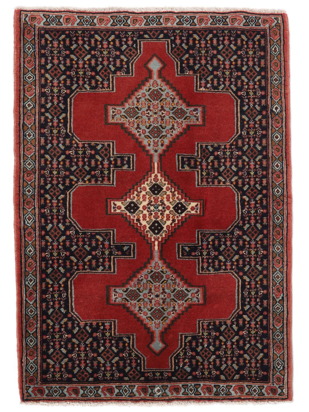 Hand-knotted Senneh rug from the Middle East in red and black