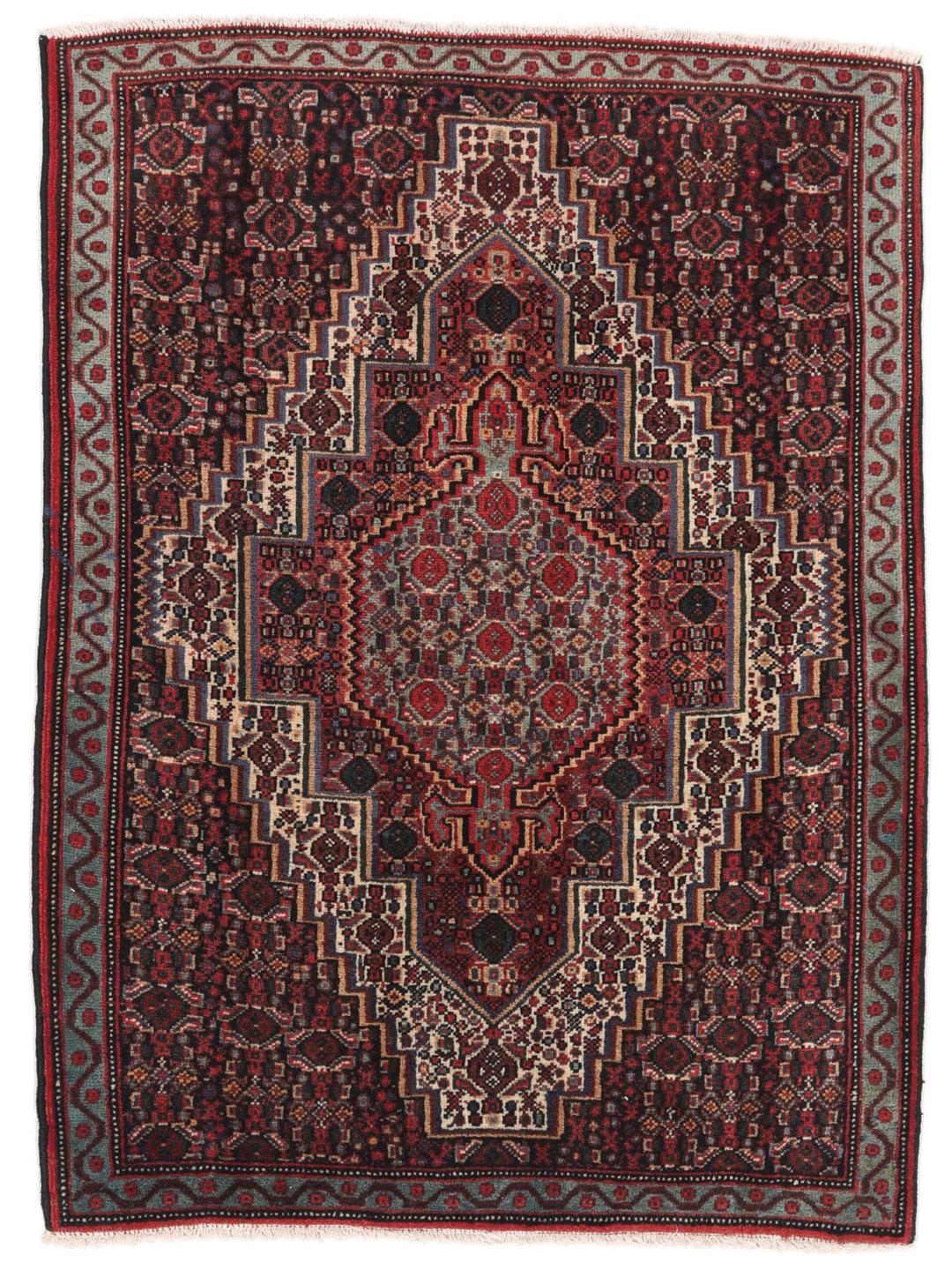 A hand-knotted Senneh rug from the Middle East in dark-red and dark-blue tones.