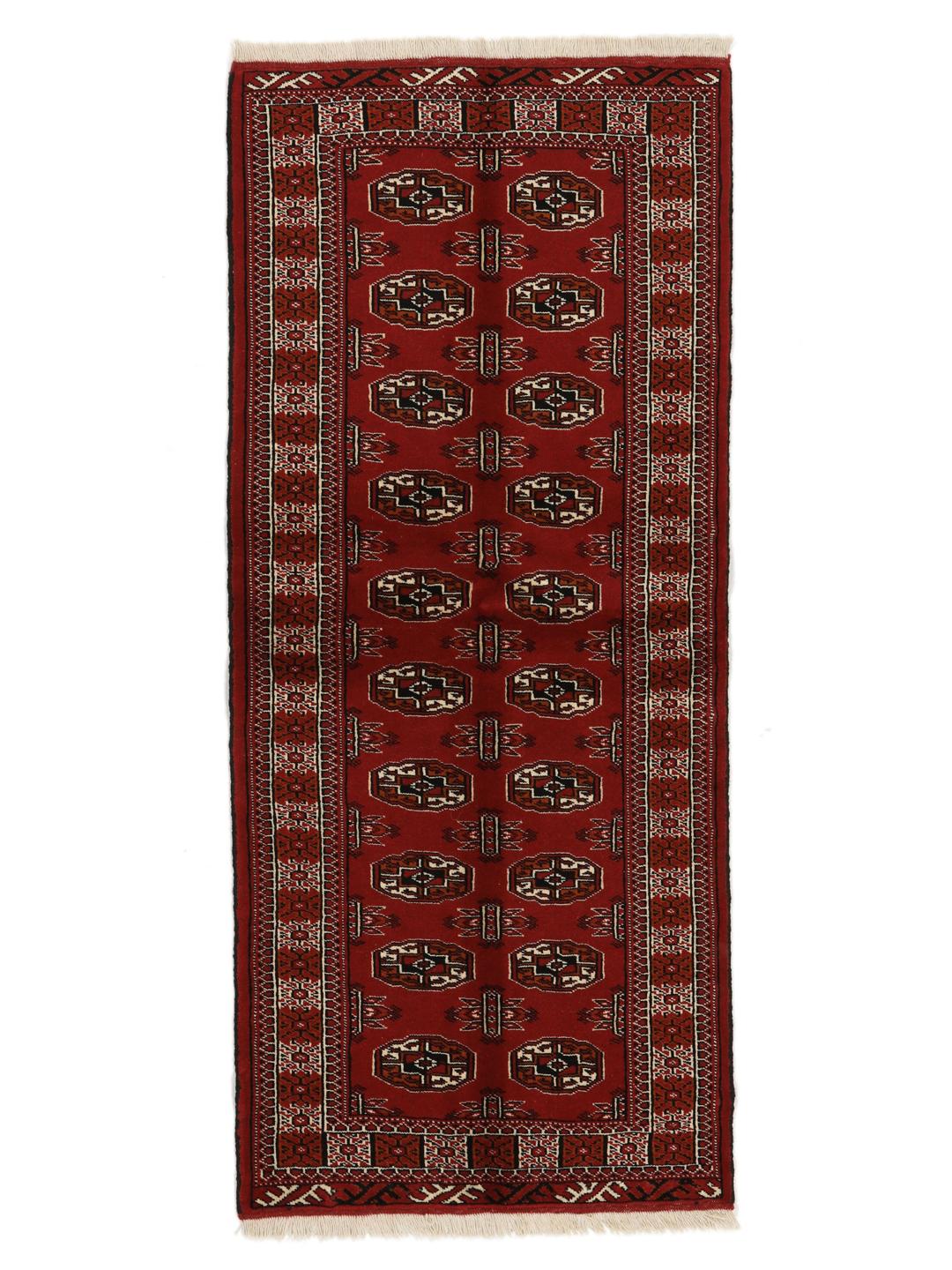 Hand-knotted Middle Eastern Turkaman runner in red with geometric motifs
