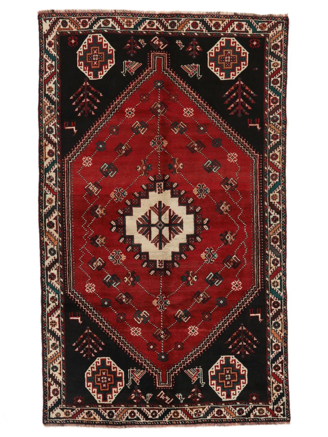 Hand-knotted Shiraz rug from the Middle East featuring a vibrant multicolor tribal design.