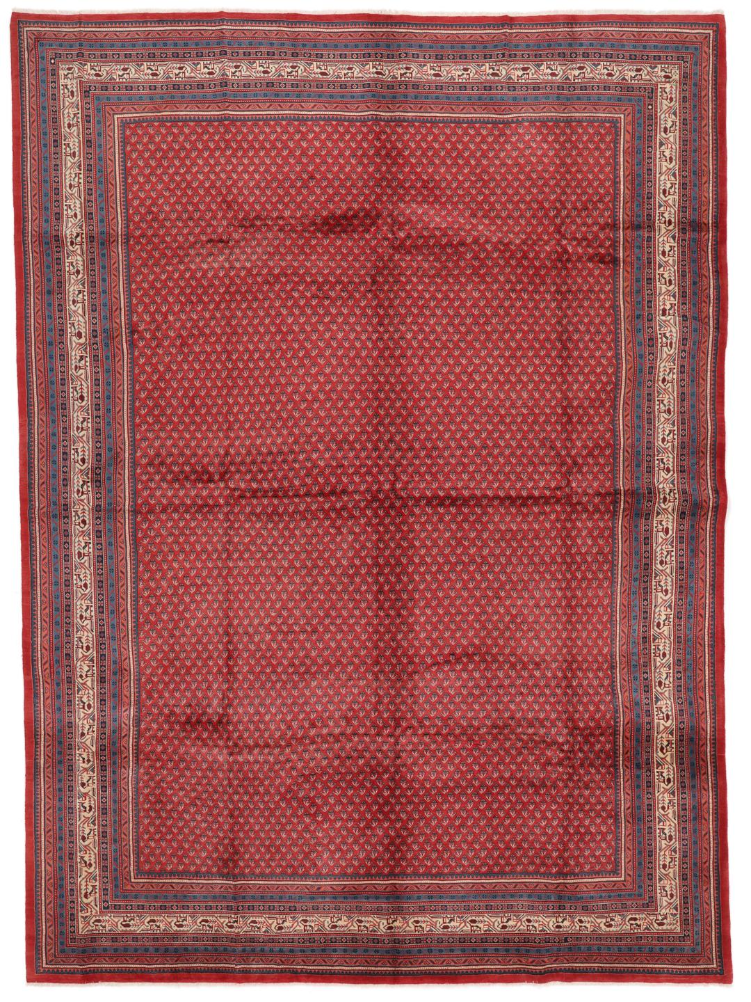A large hand-knotted Sarough Mir rug with a deep red field and intricate border from the Middle East.