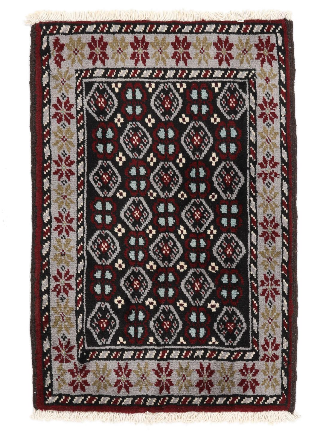 Hand-knotted Beluch rug with geometric patterns in multicolor from the Middle East