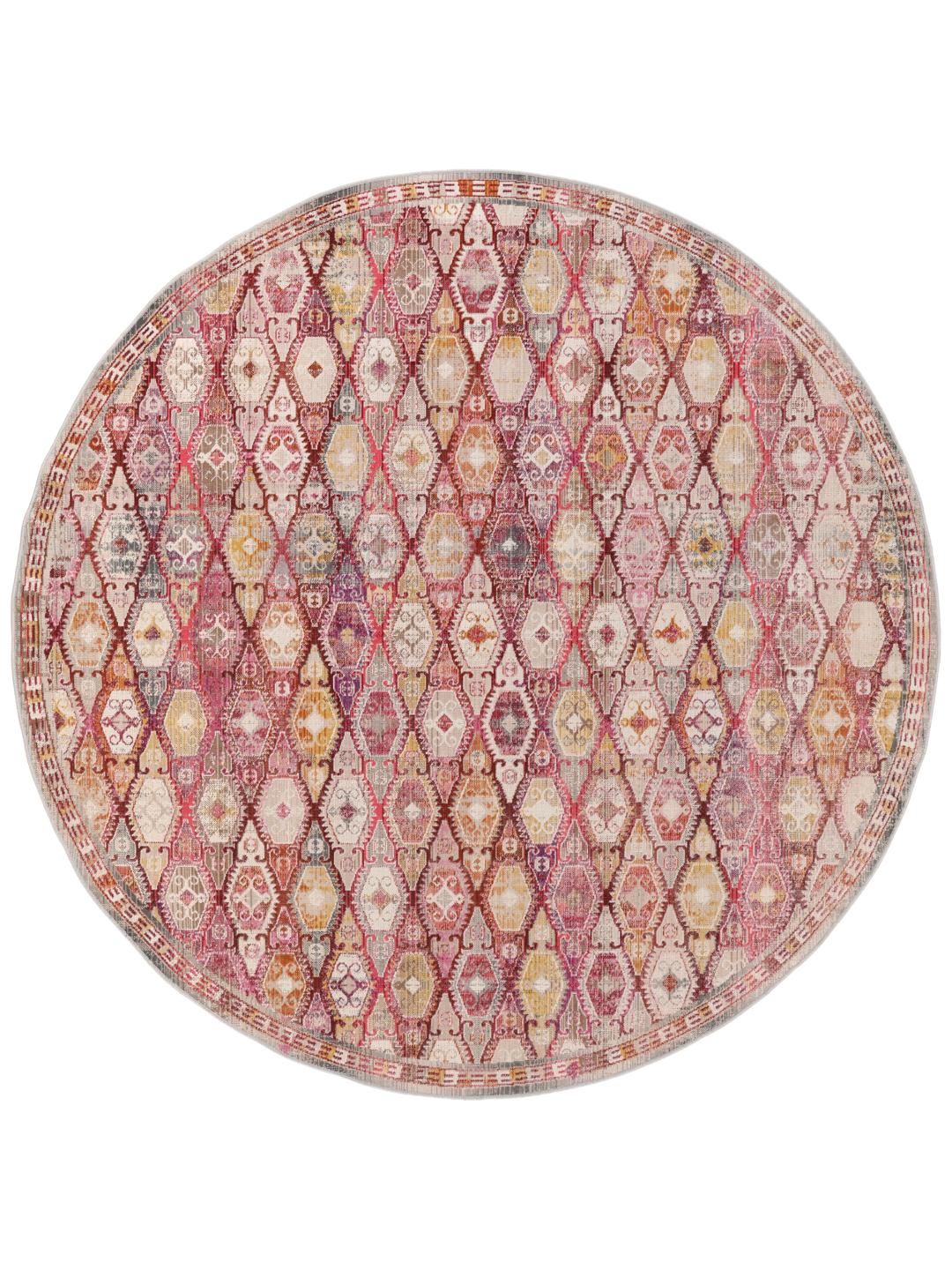 Rundt tæppe med et rødt og pink geometrisk mønster