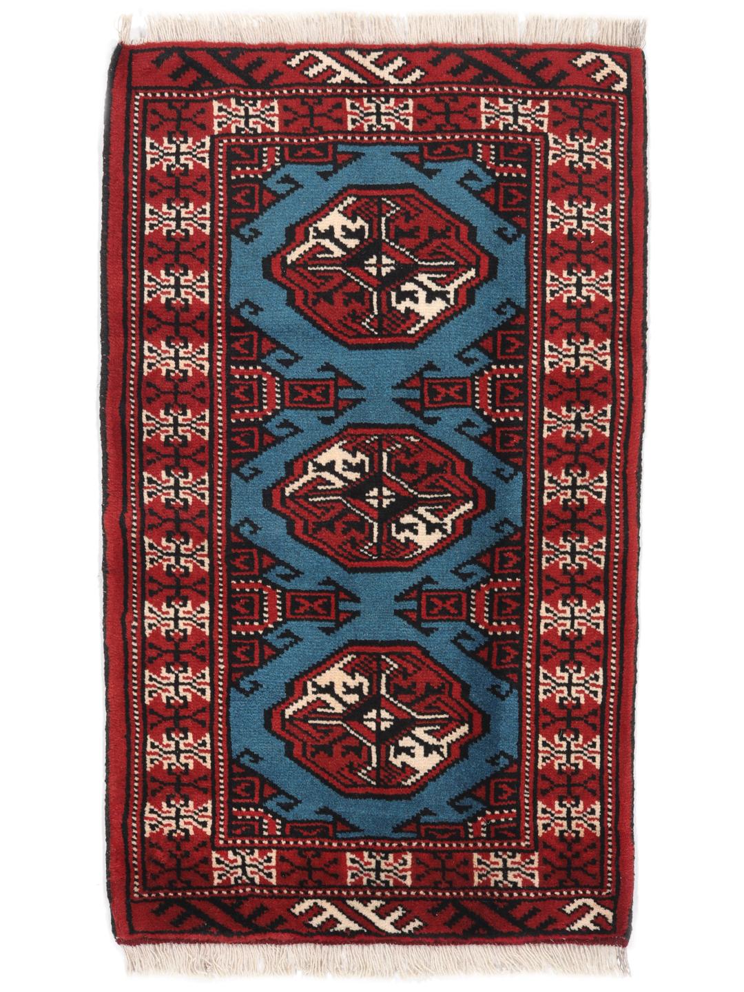 Hand-knotted Turkaman rug from the Middle East in red and blue tones