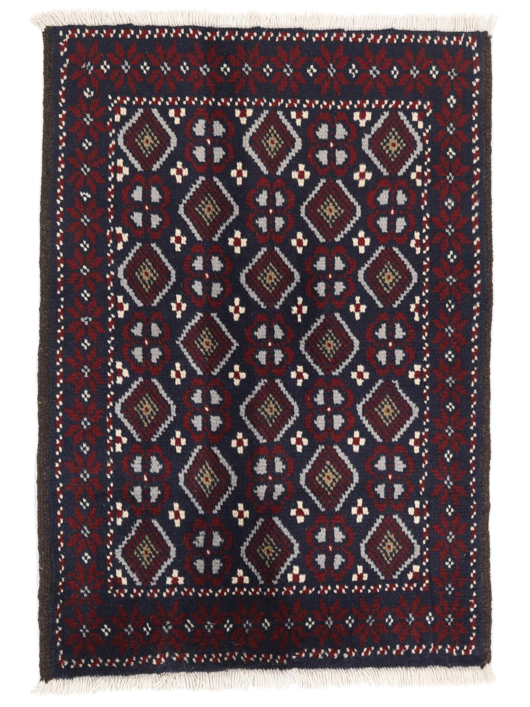 Hand-knotted Baluch rug with geometric motifs in dark-blue and red from the Middle East