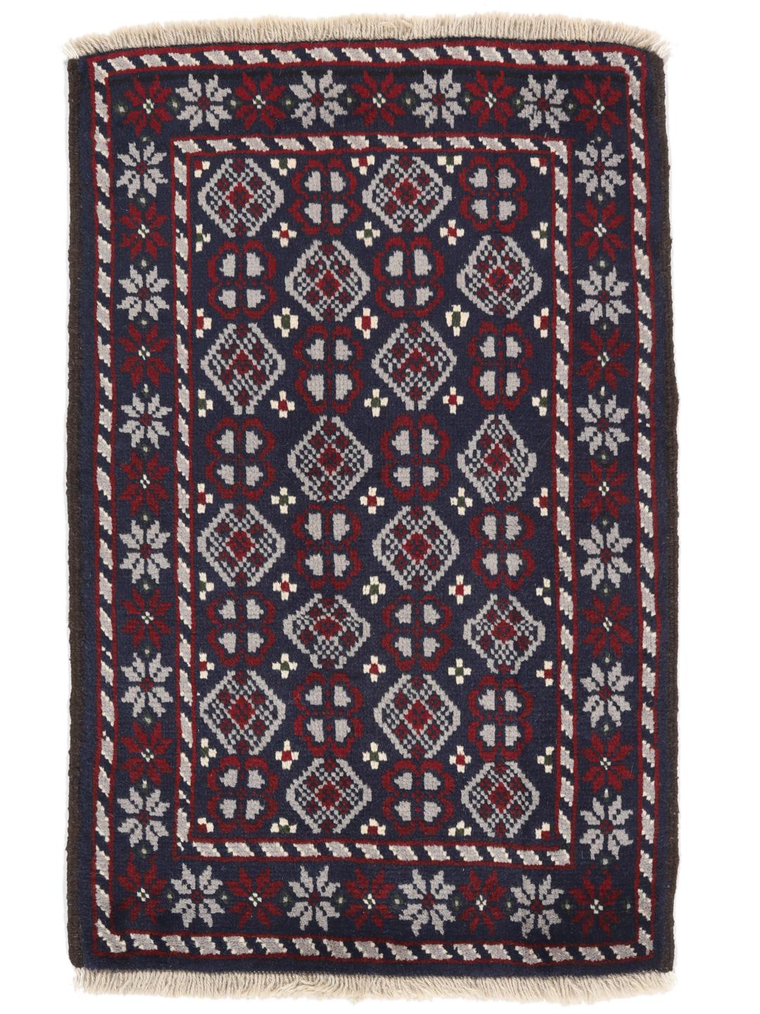 Handmade Baluch rug from the Middle East in dark-blue and dark-red tones.
