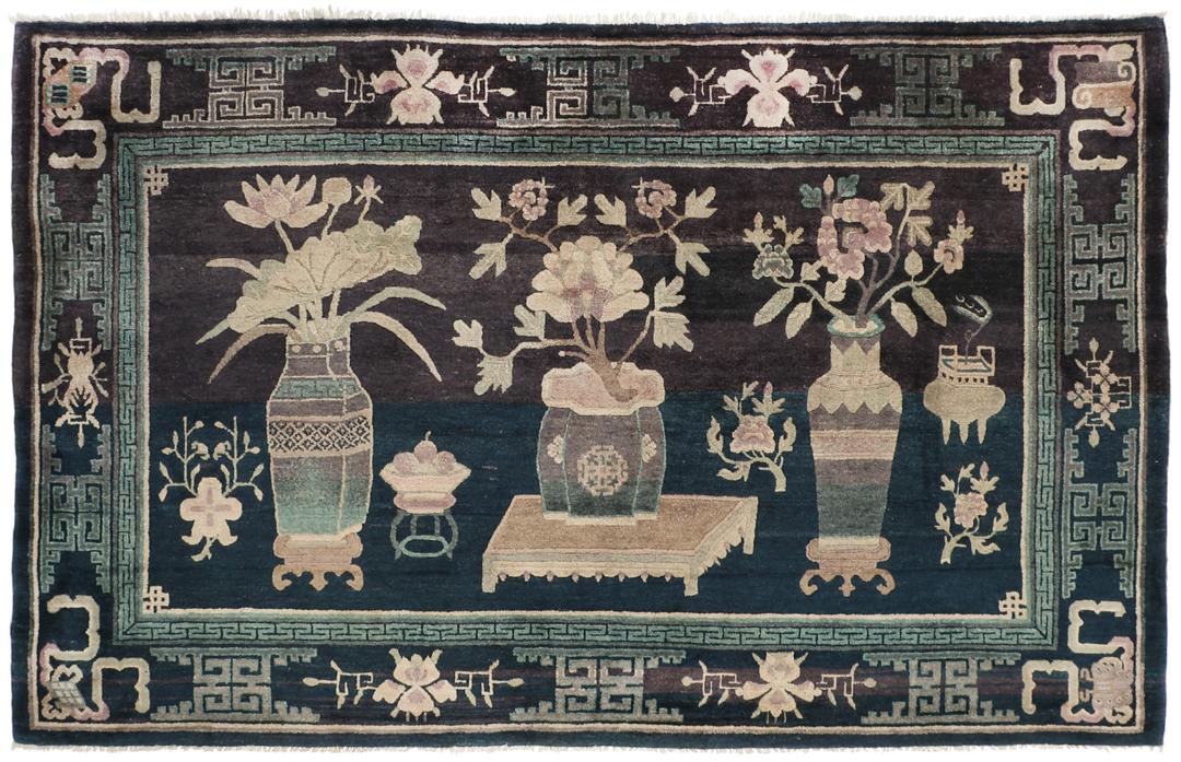 Antique Chinese hand-knotted rug in deep blue and black with floral motifs