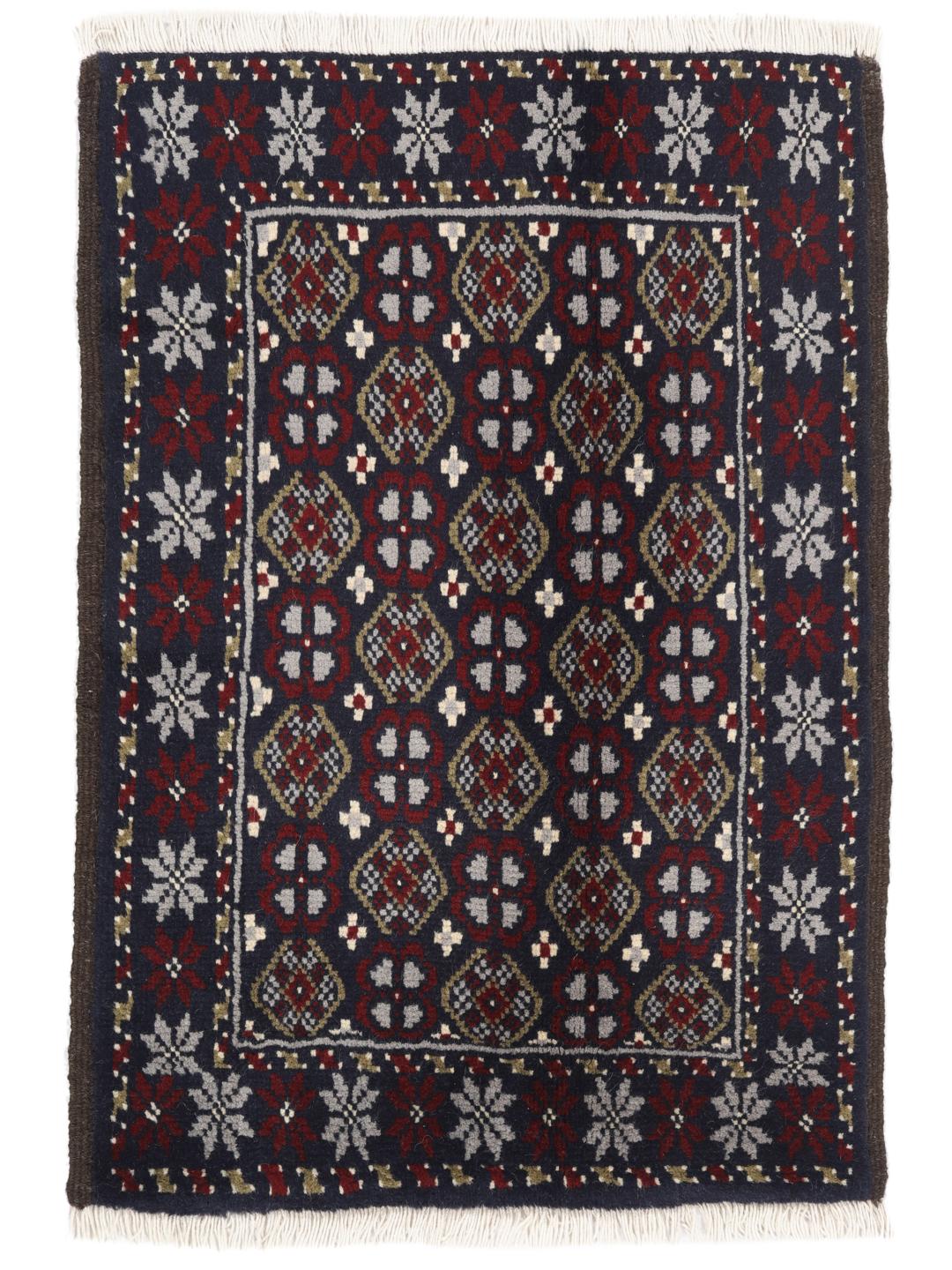 Ein handgeknüpfter Beluch-Teppich aus dem Nahen Osten mit einem tiefdunkelblauen und roten geometrischen Muster