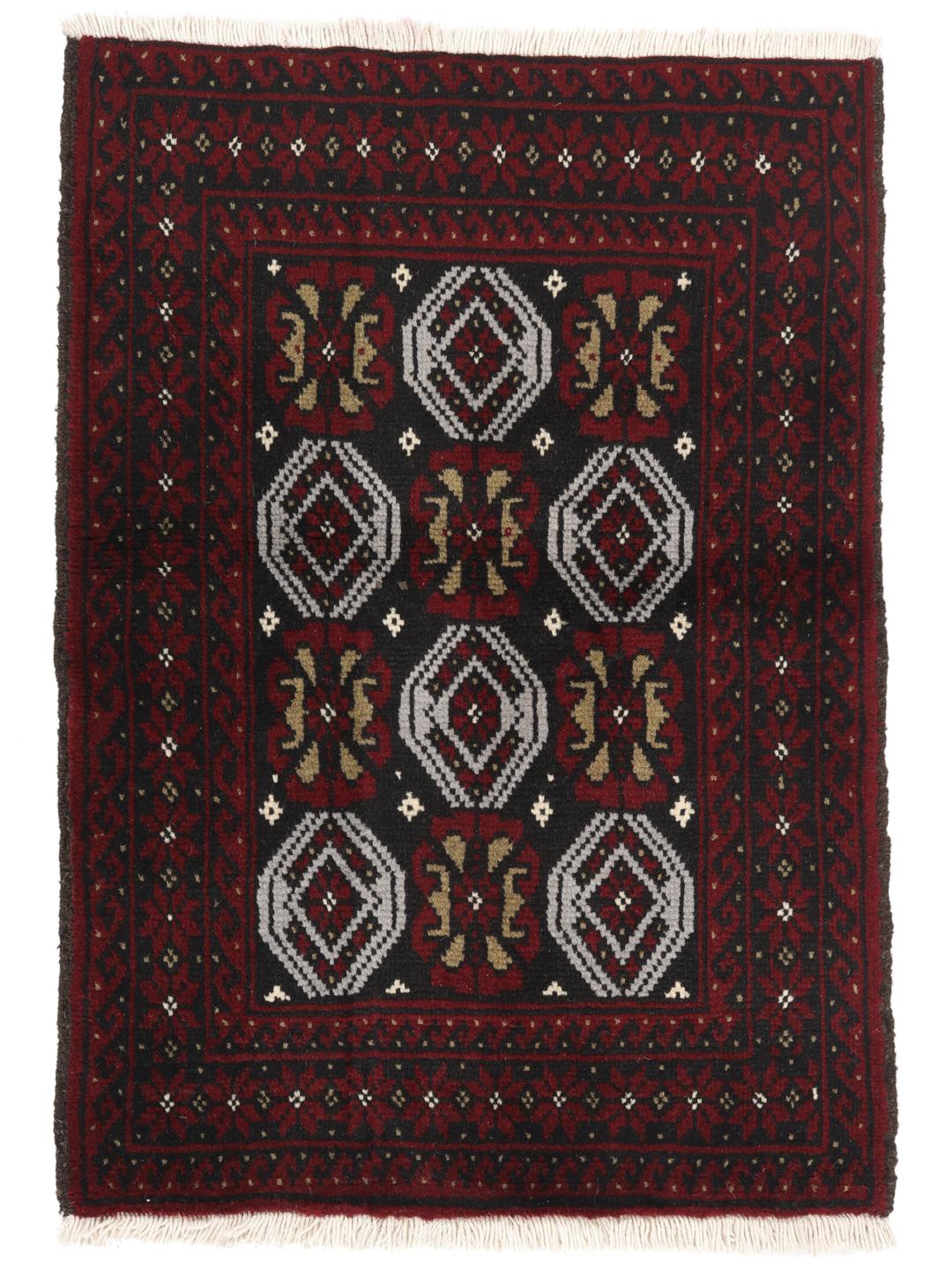 A small, one-of-a-kind Baluch rug from the Middle East with a dark-red and black geometric pattern.