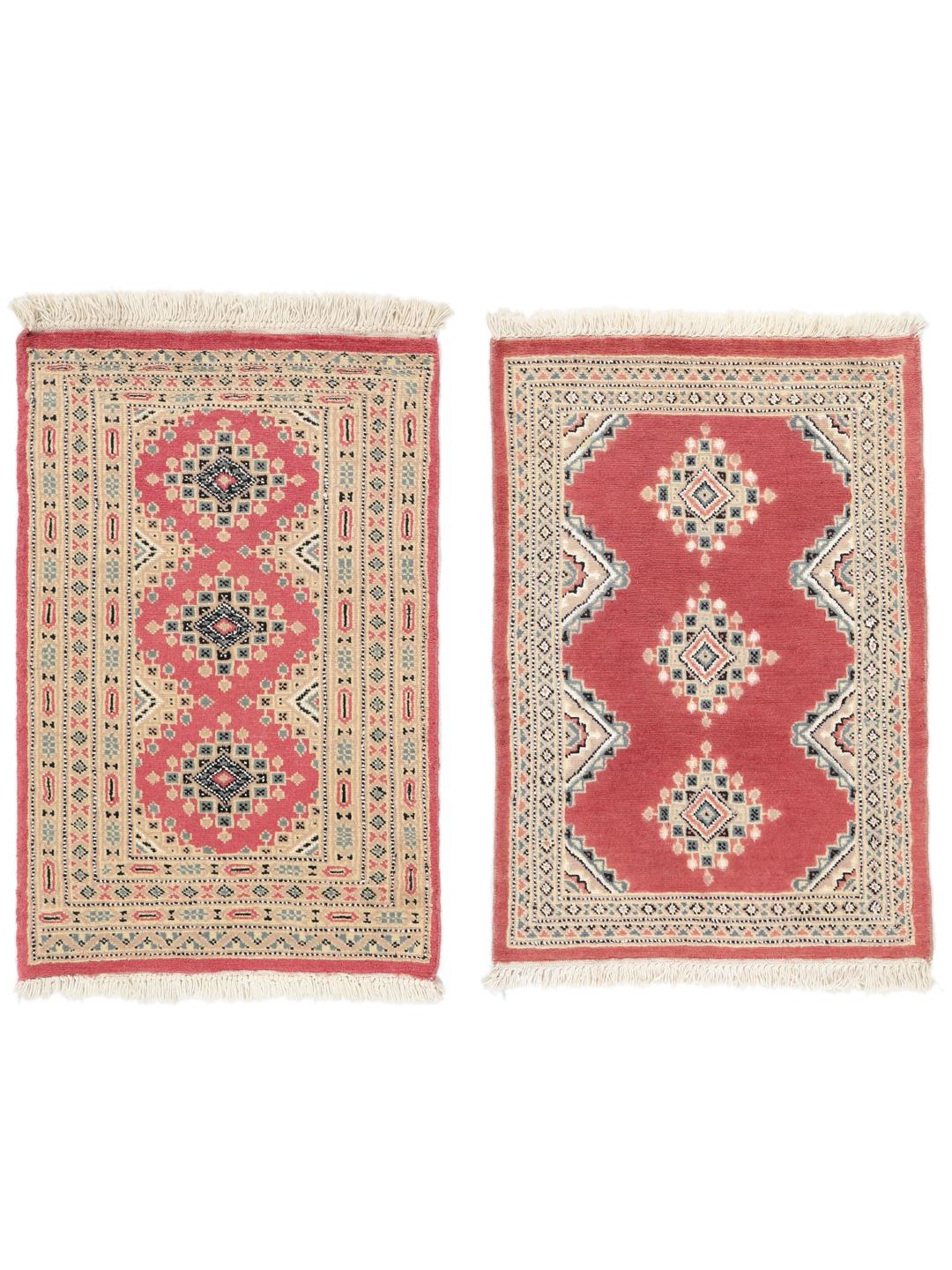 A hand-knotted red Pakistan Bokhara 2ply rug with geometric motifs