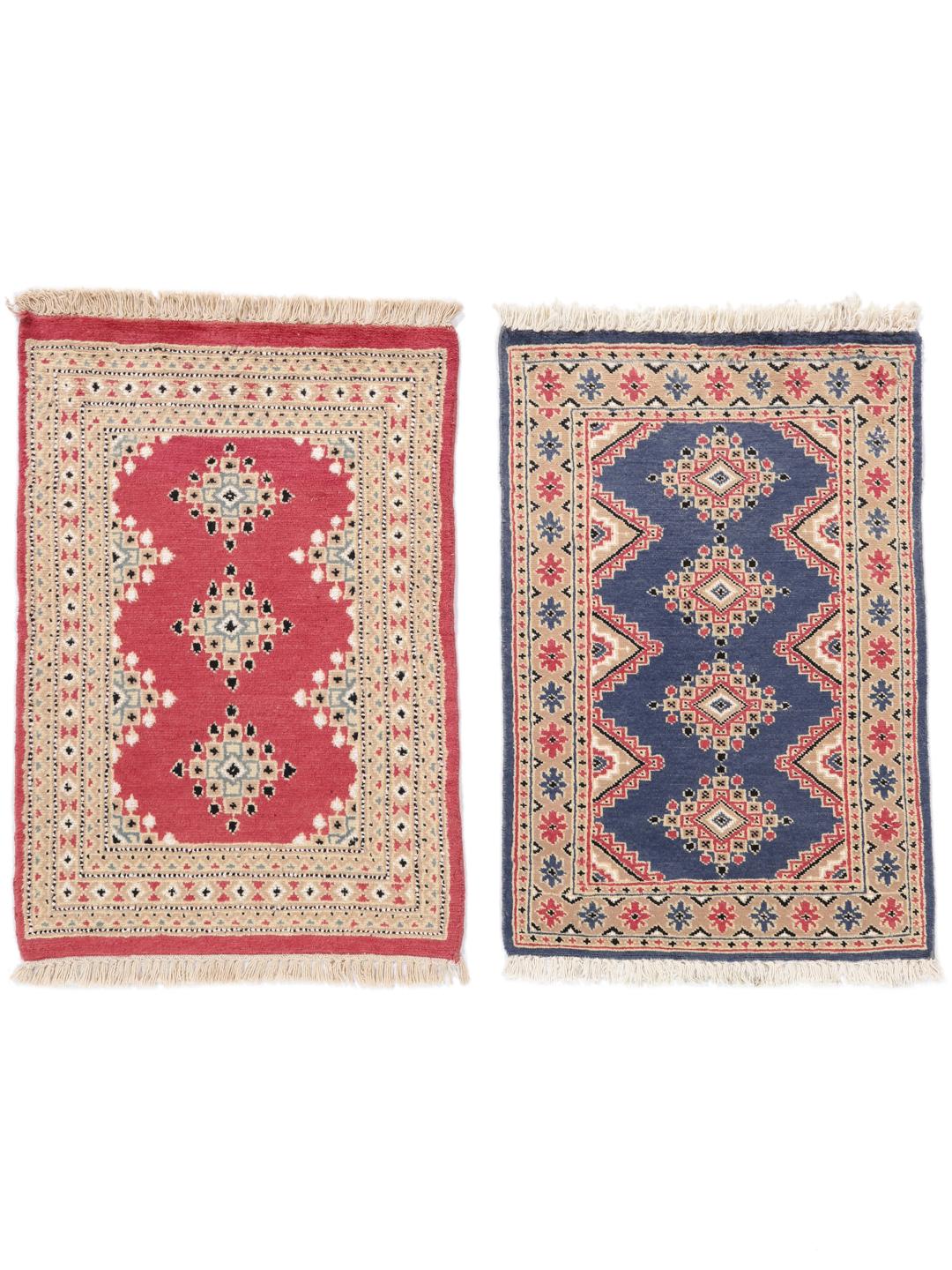 Hand-knotted wool rug from Pakistan in red and blue tones