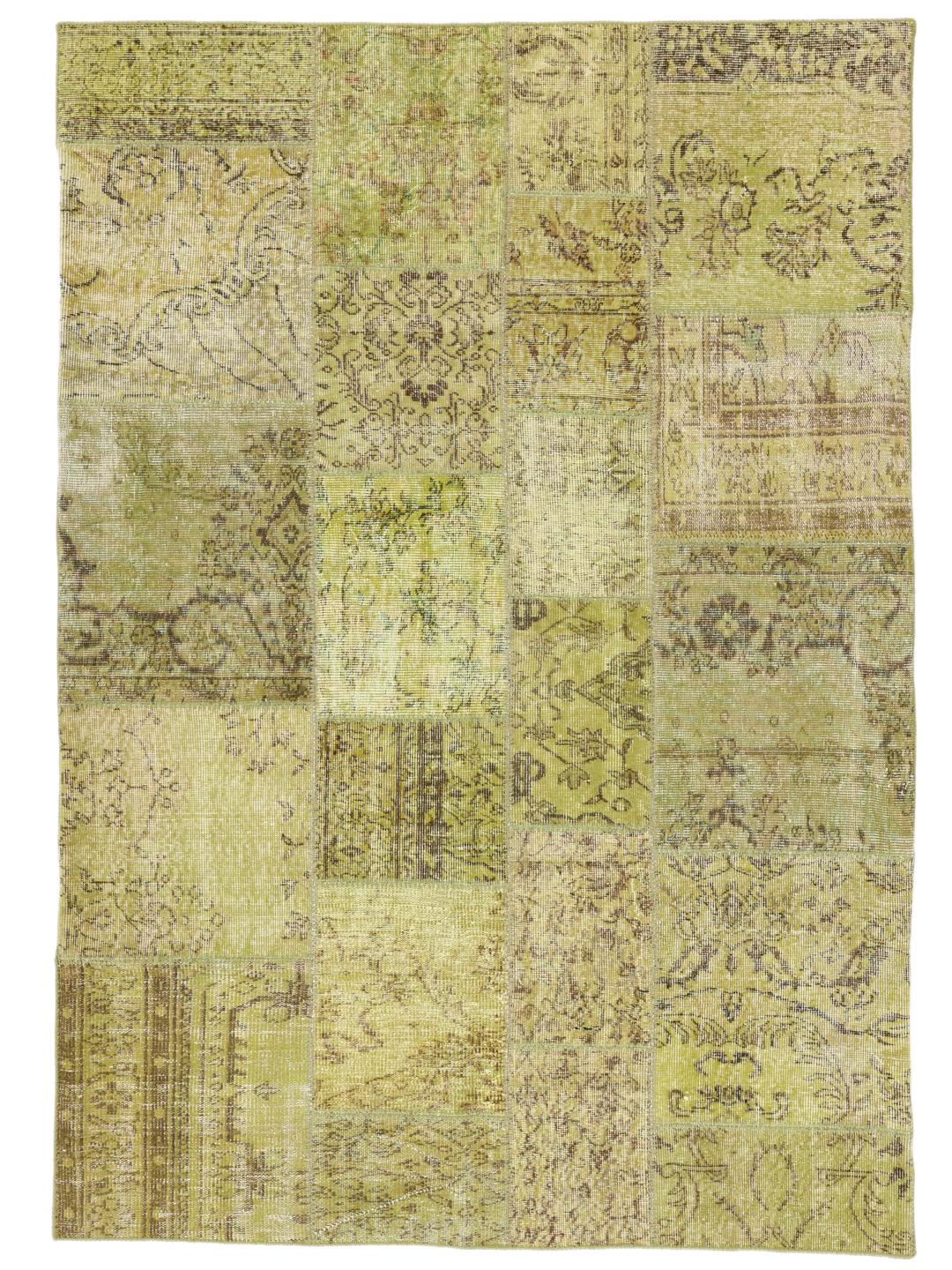 Et unikt tyrkisk patchwork-tæppe med en levende lysegrøn farvepalette.