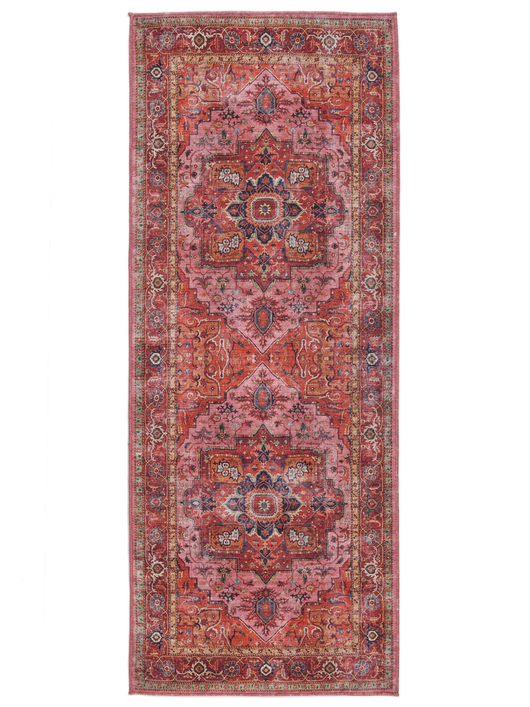 Tapis de couloir rouge et rose avec un design de médaillon central