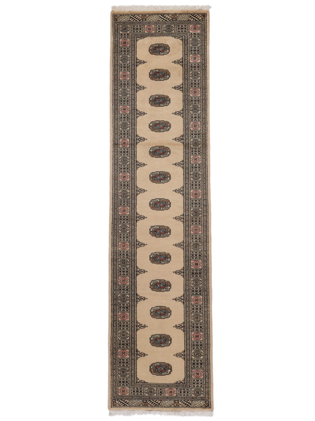Handgeknoopte beige loper uit Pakistan met traditionele geometrische patronen