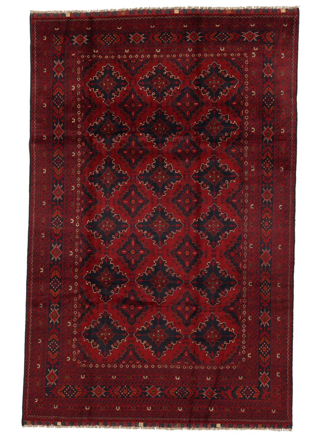 A hand-knotted Kunduz rug from Afghanistan with a dark-red field and geometric patterns.