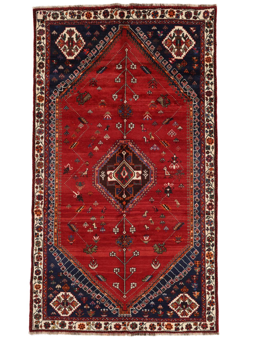 Hand-knotted Qashqai rug with a red field and geometric tribal patterns