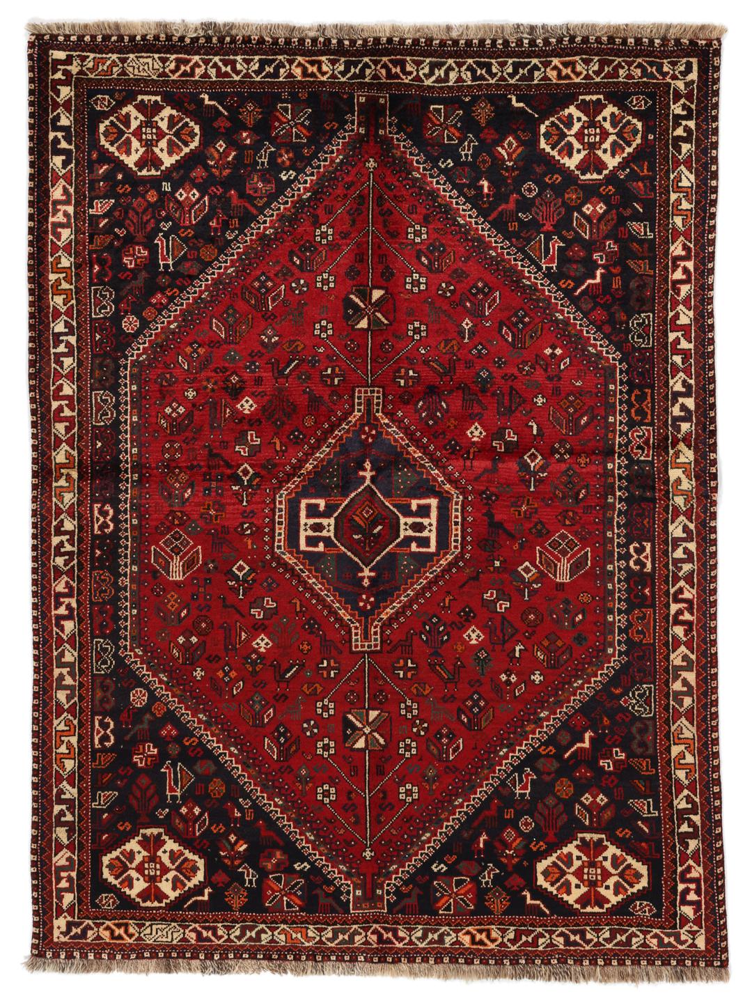 Hand-knotted Middle Eastern tribal rug with red and black geometric patterns