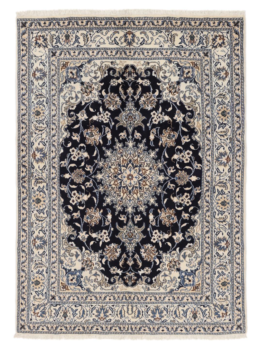 A hand-knotted Nain rug from the Middle East featuring a blue and beige floral design.