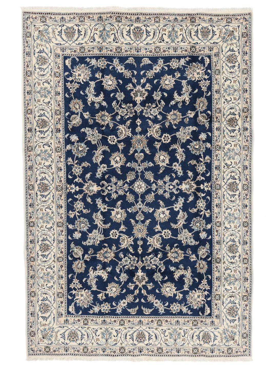 Hand-knotted Nain rug from the Middle East with a deep blue floral pattern