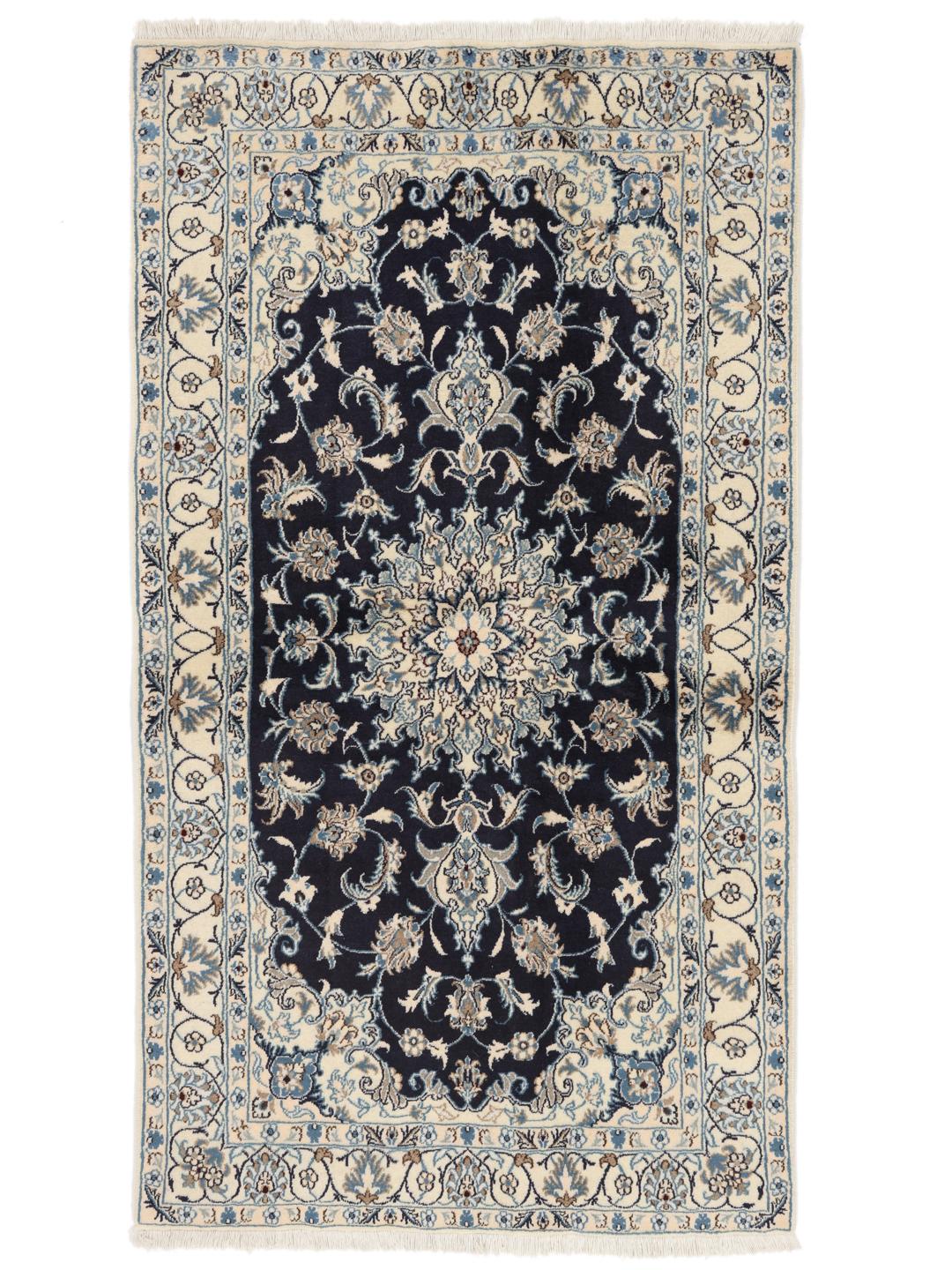 A hand-knotted Nain rug from the Middle East with a navy blue and cream floral medallion design.