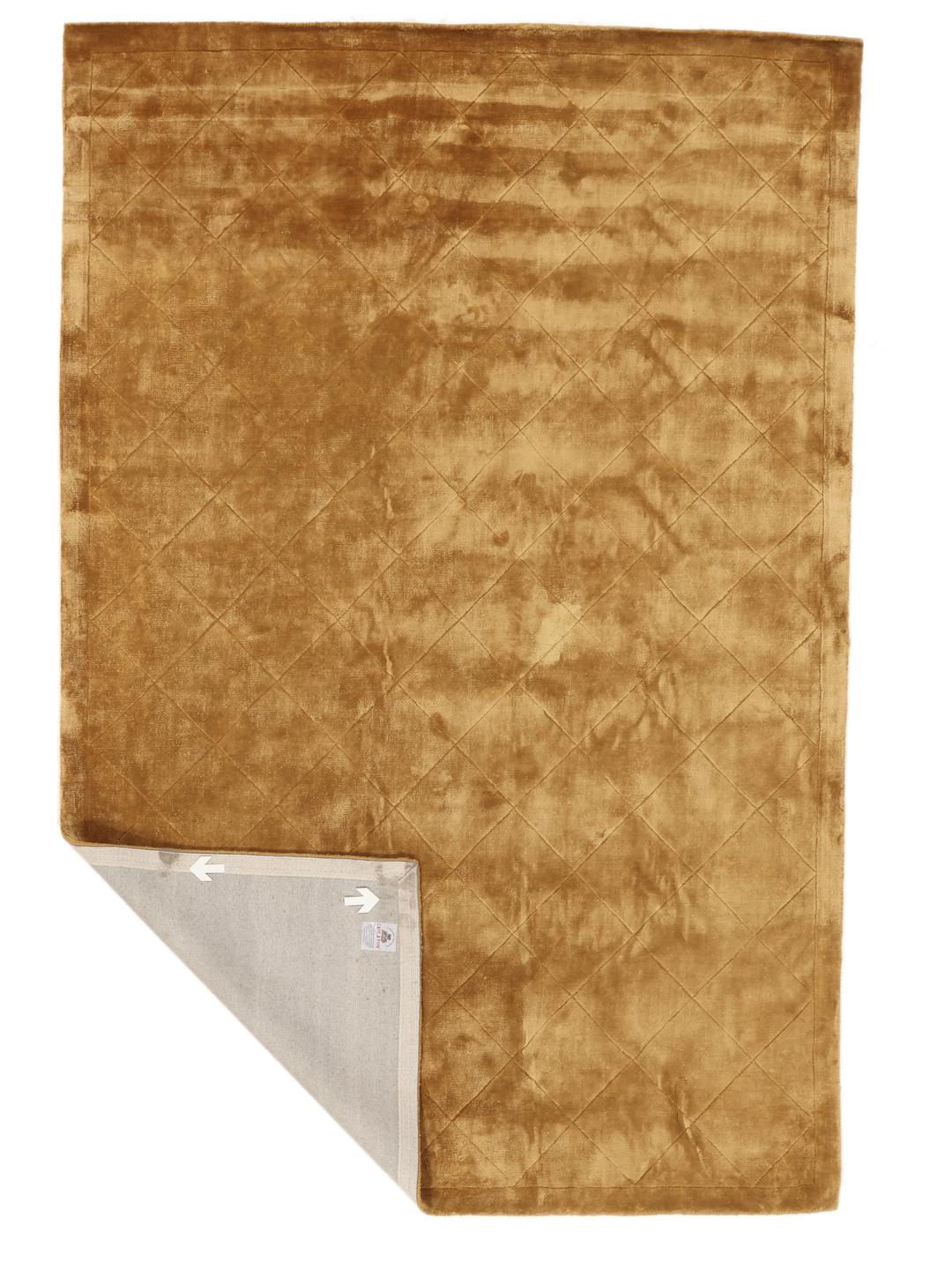 A warm brown rug with a diamond pattern