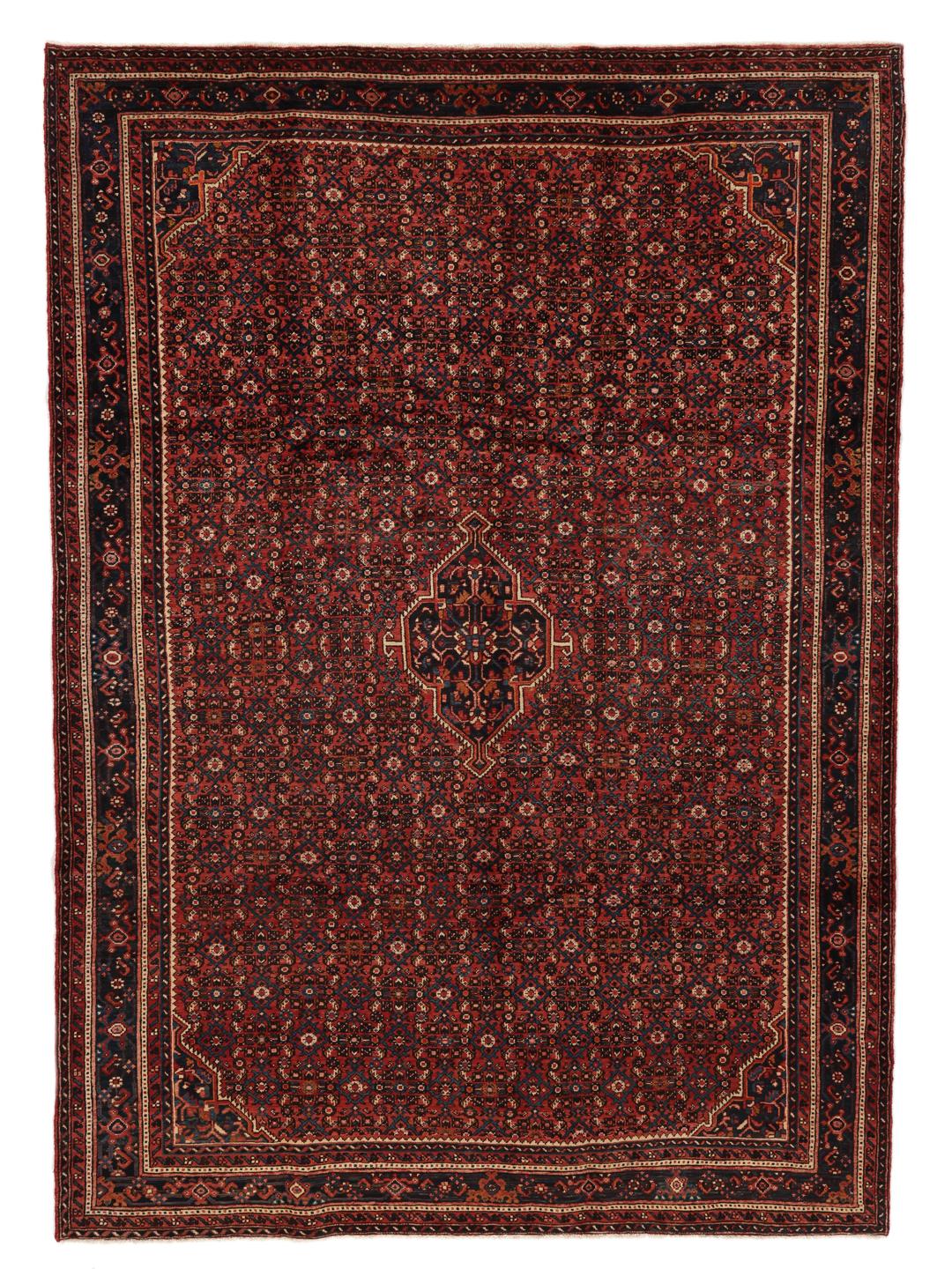 A hand-knotted Hosseinabad rug featuring a traditional dark-red field and detailed patterns.