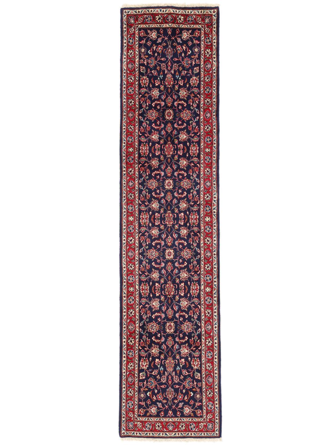 Un tapis de couloir Yazd du Moyen-Orient noué à la main avec un motif floral bleu foncé.