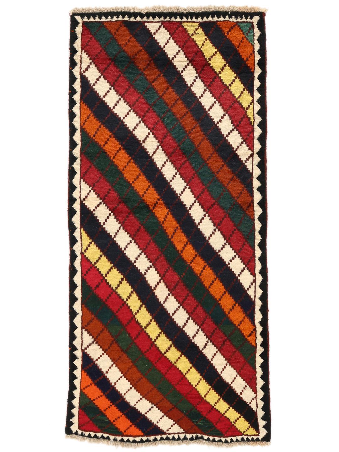 A vibrant, multicoloured Shiraz rug with a bold diagonal pattern and a decorative border.